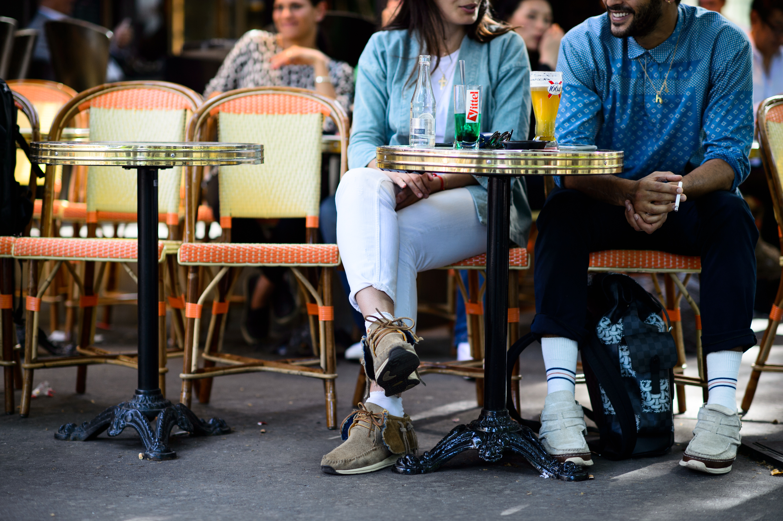 Woman and man sitting at the table in brasserie