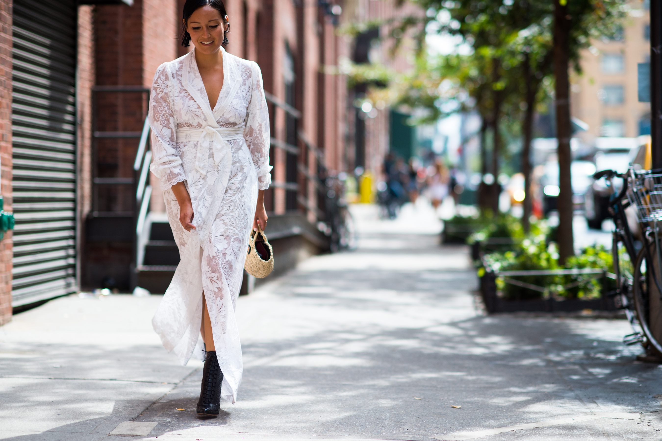 American editor wearing white dress before the show