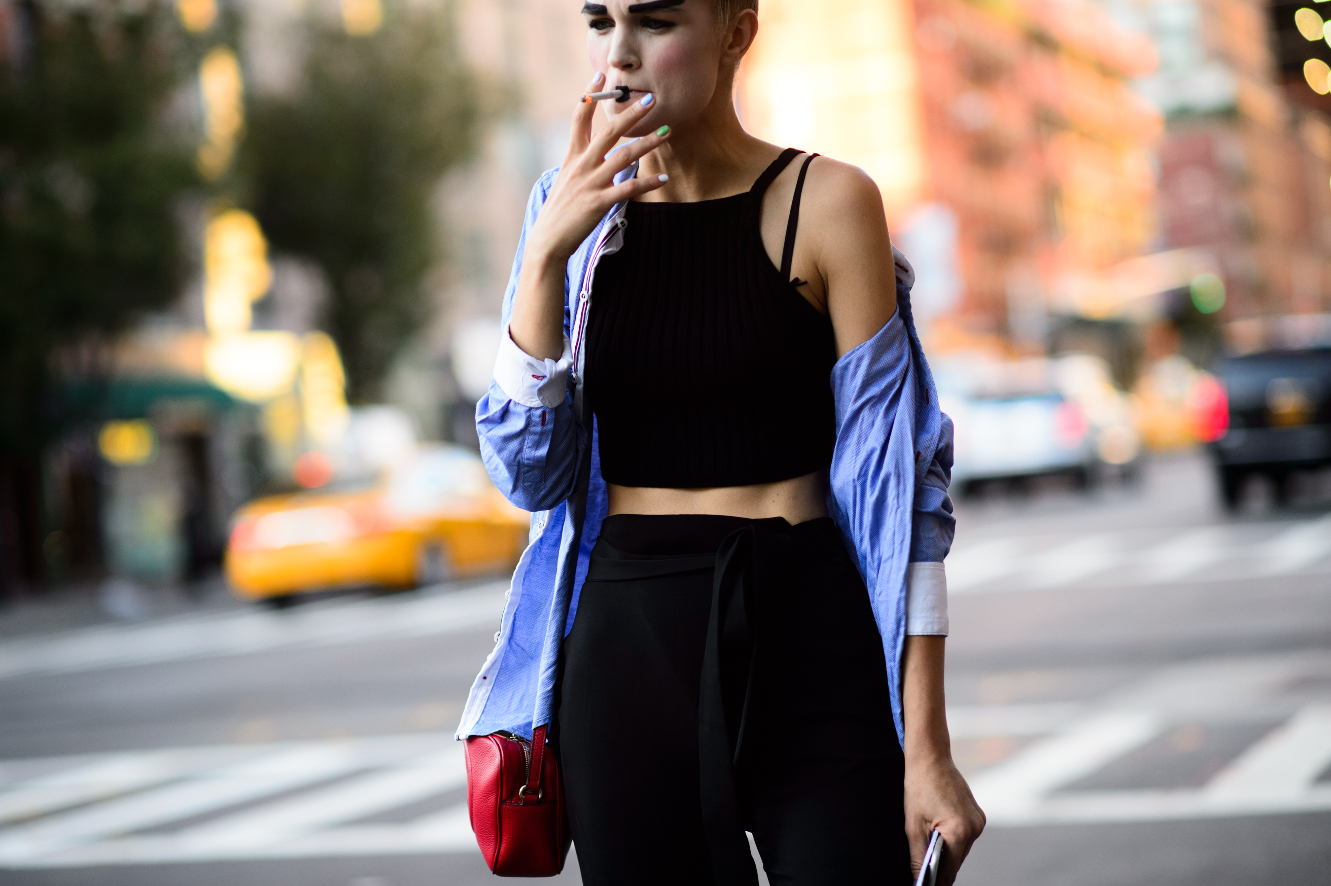 Russian model with dark make up smoking after the show