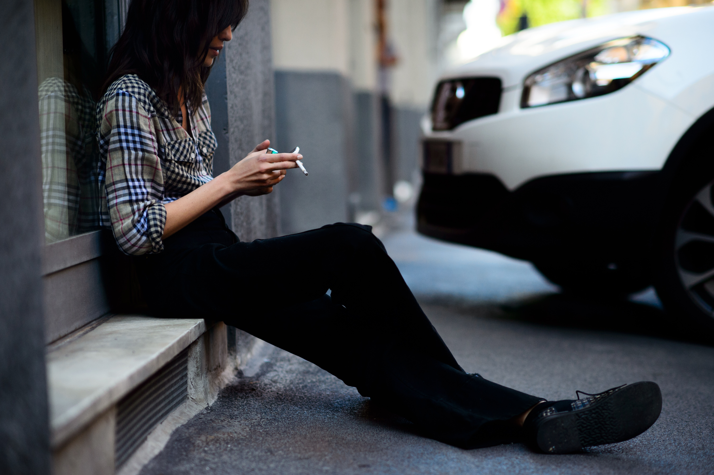 Woman smoking on the street