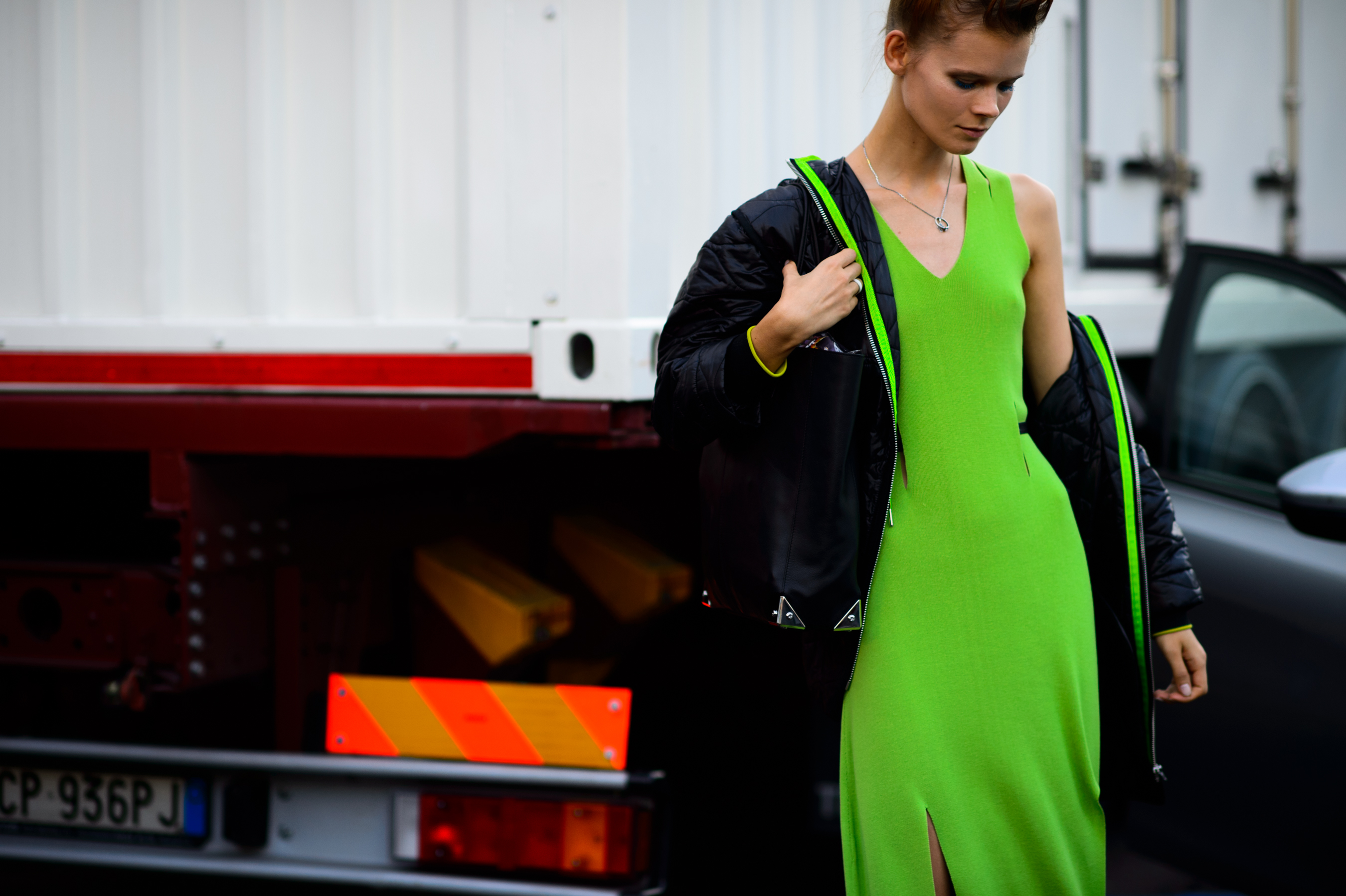 Model wearing a green dress after Tod's SS16