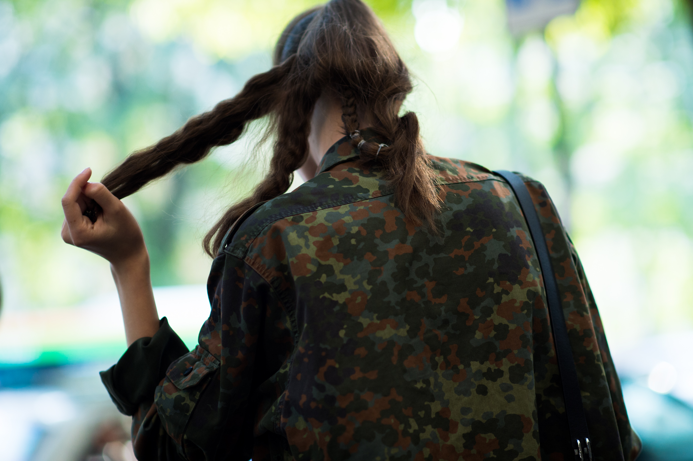 Model undoing her hair after a show