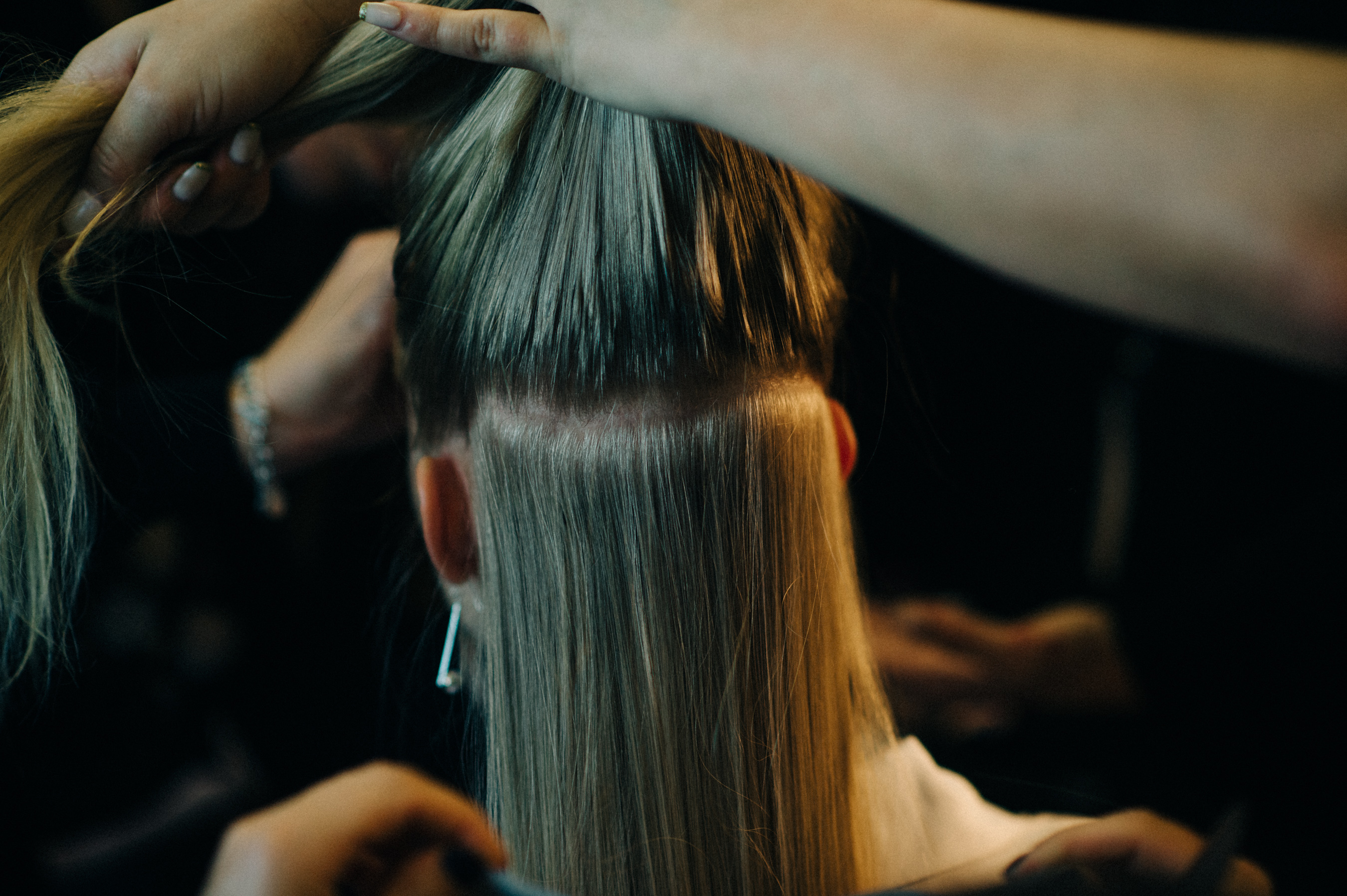 Model getting hair done before the show