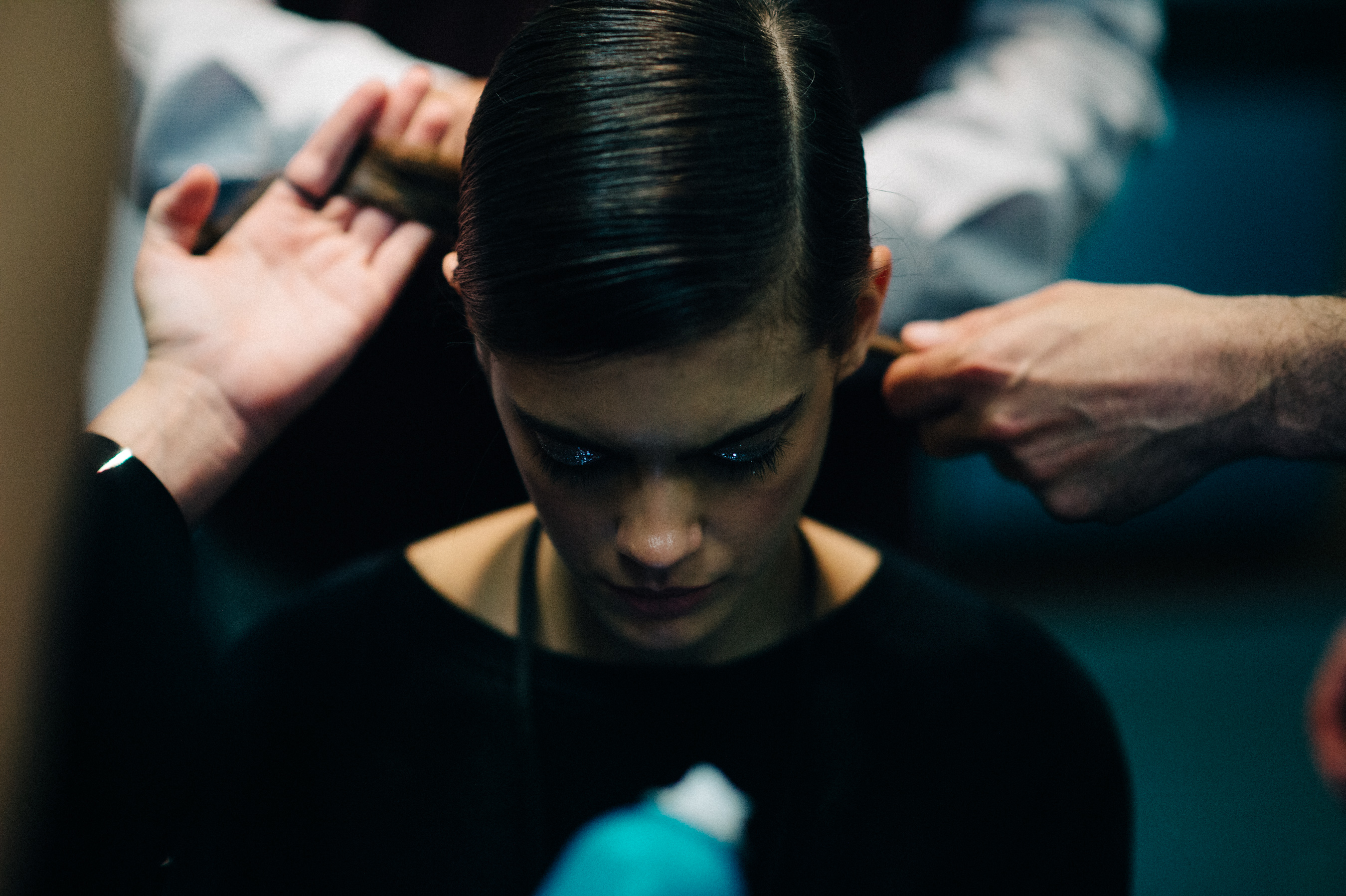 Model getting hair and make up before the show