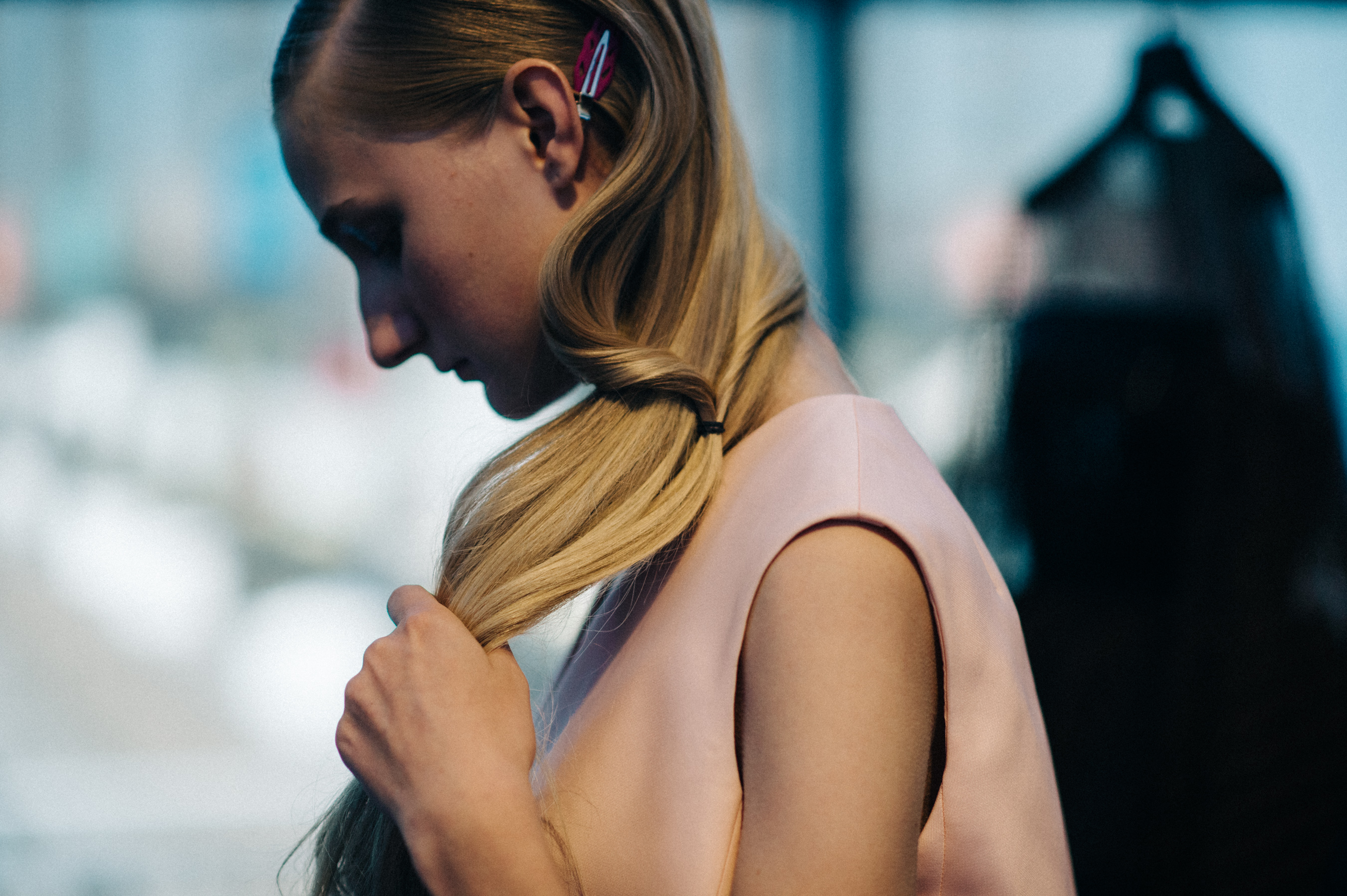 Model touching her hair before the show