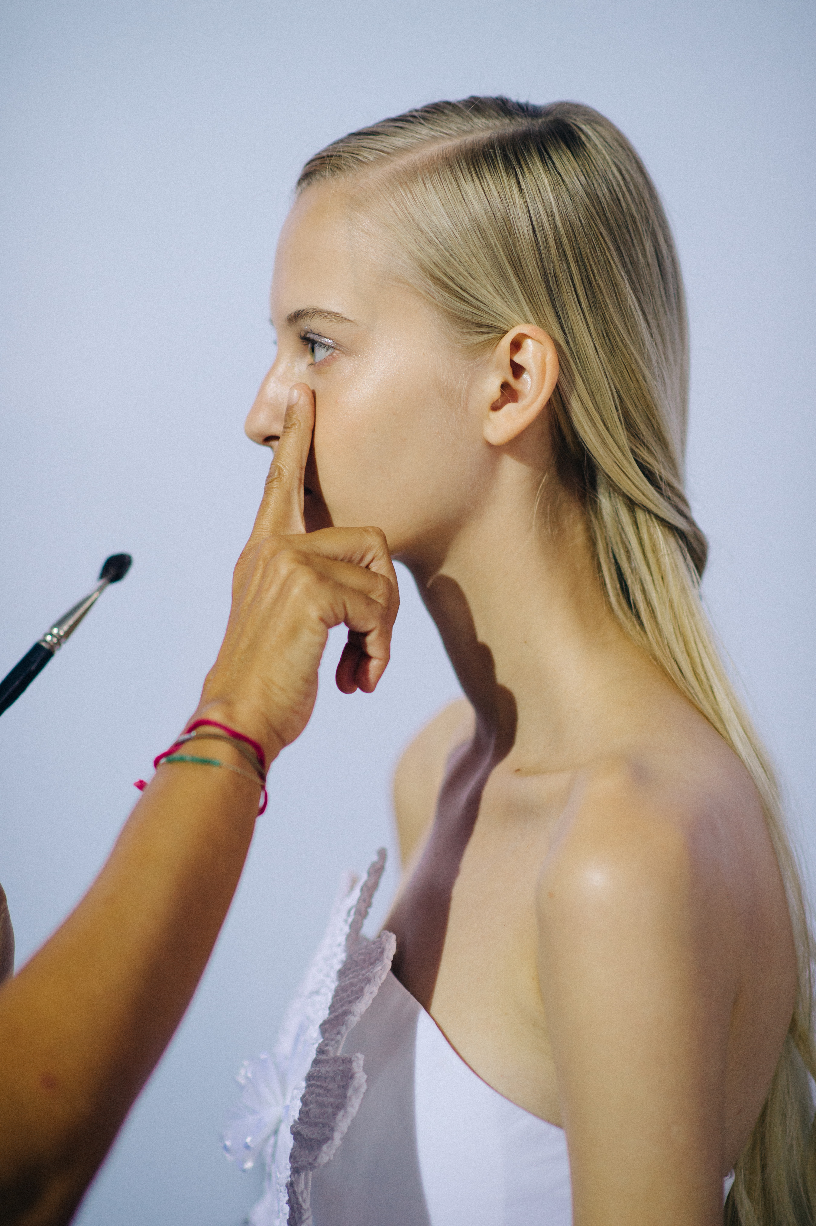 Model getting hair fixed at first looks