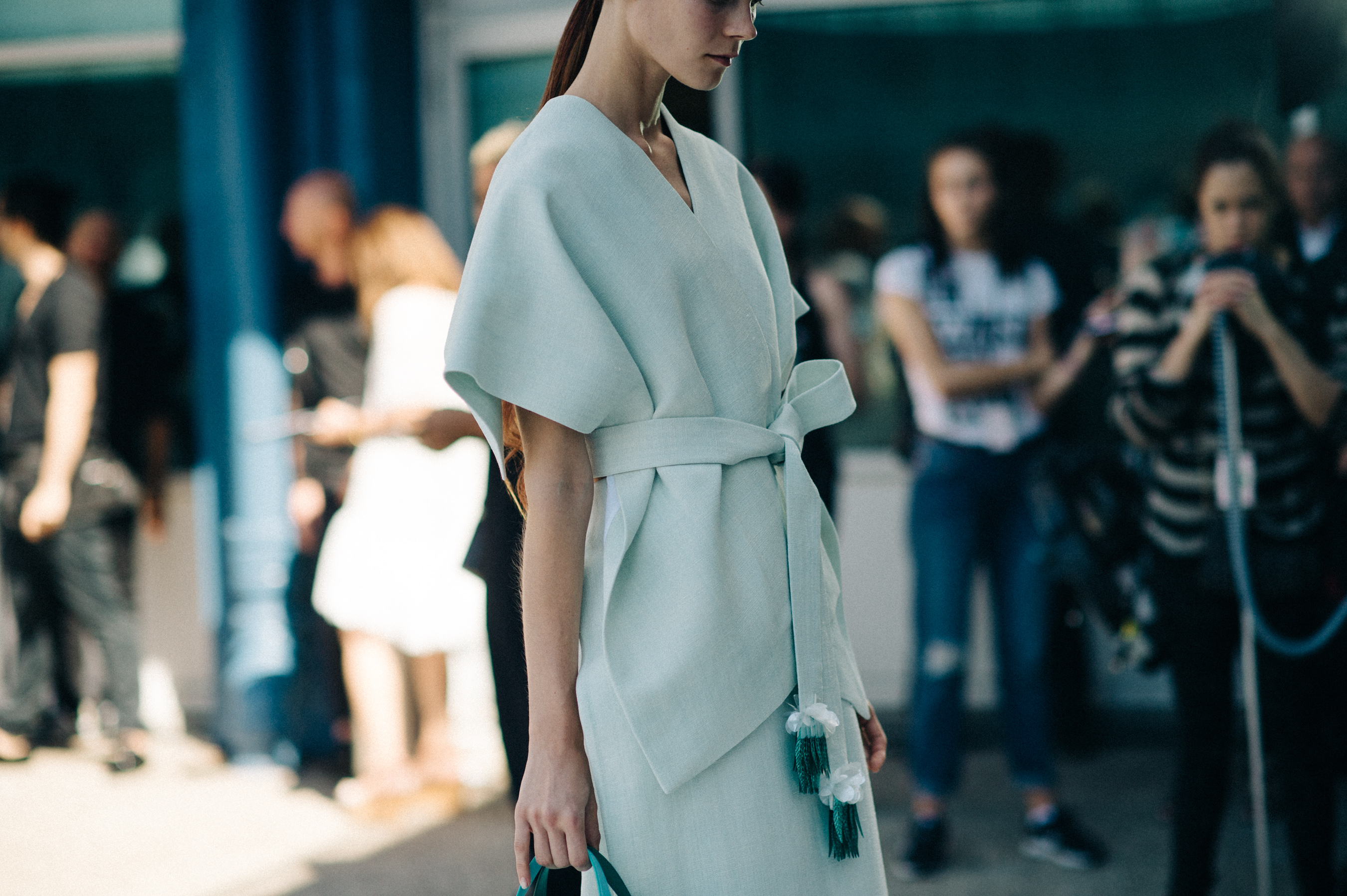 Model in blue outfit before the show