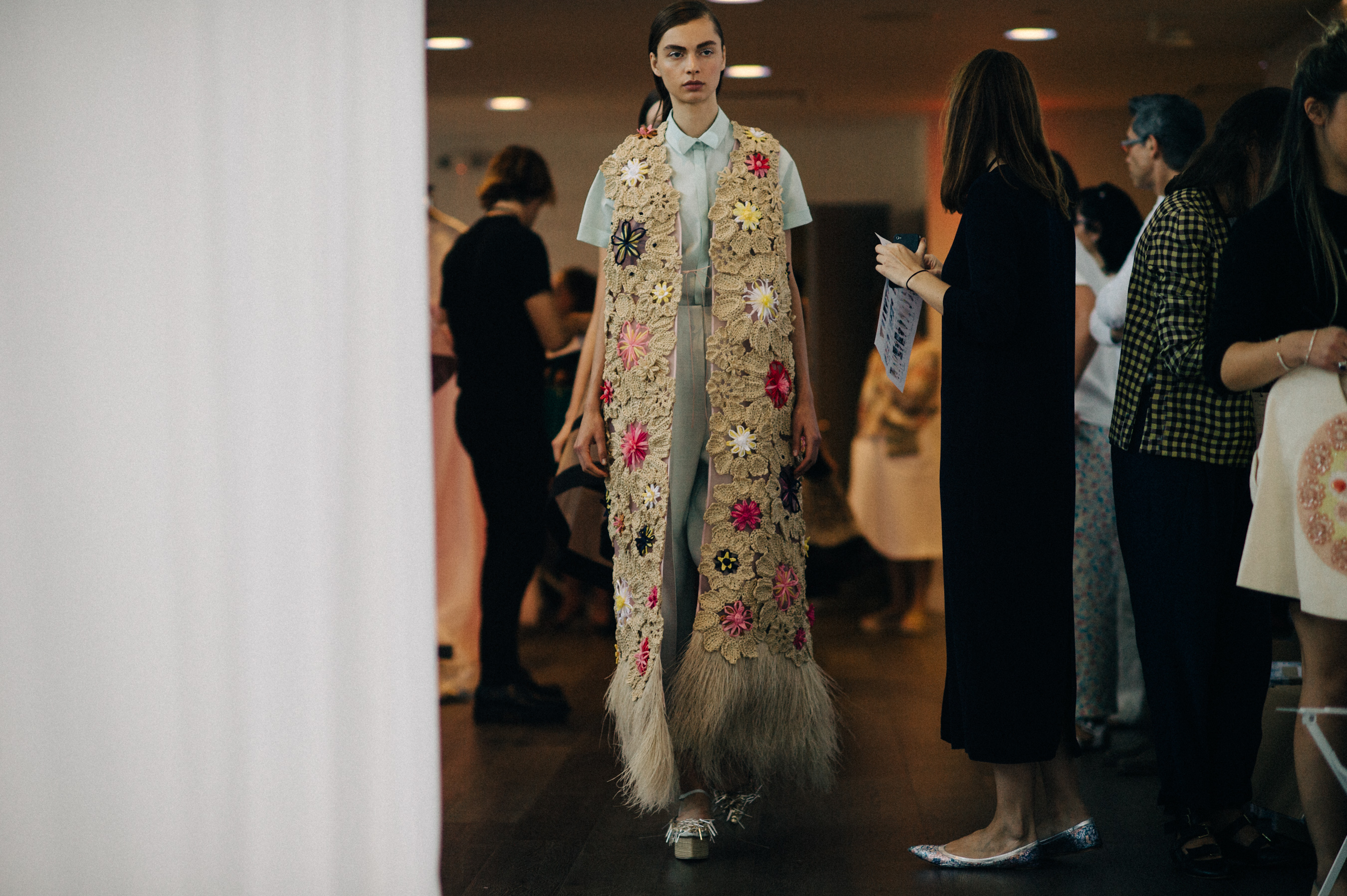 Model in long embroidered cardigan