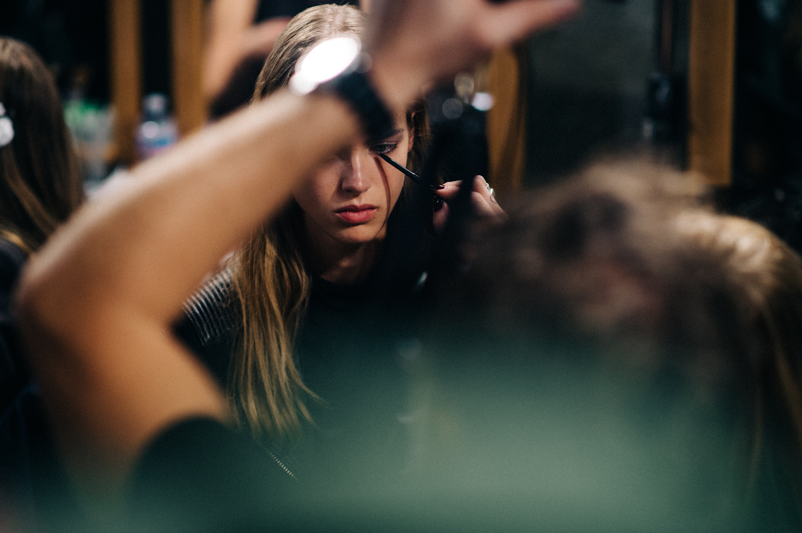 Model getting her make up done