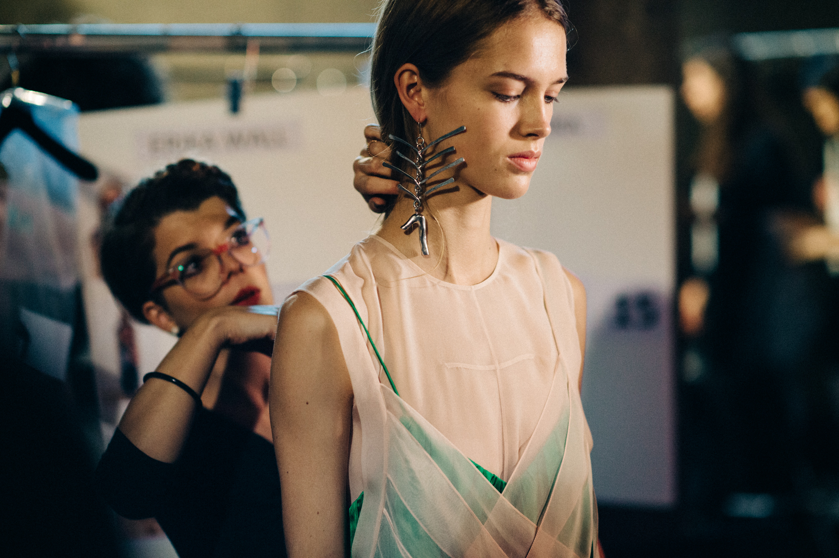 Model with big earring before the show