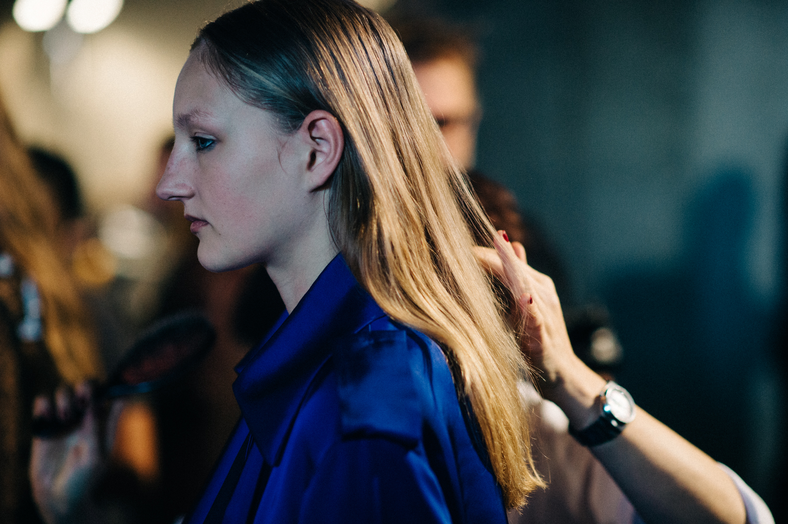 Model getting hair done before the show