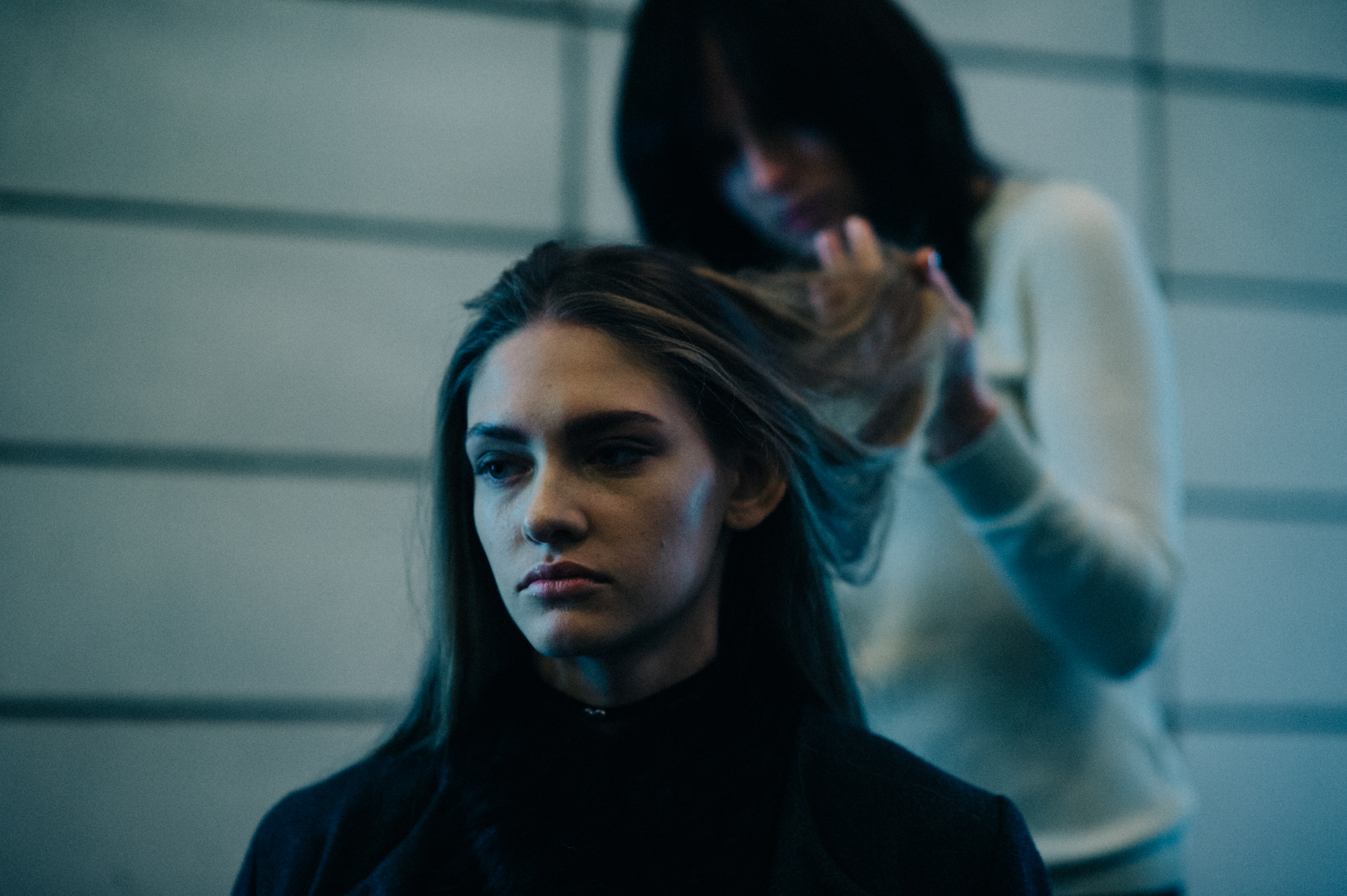 Model getting hair done before the show