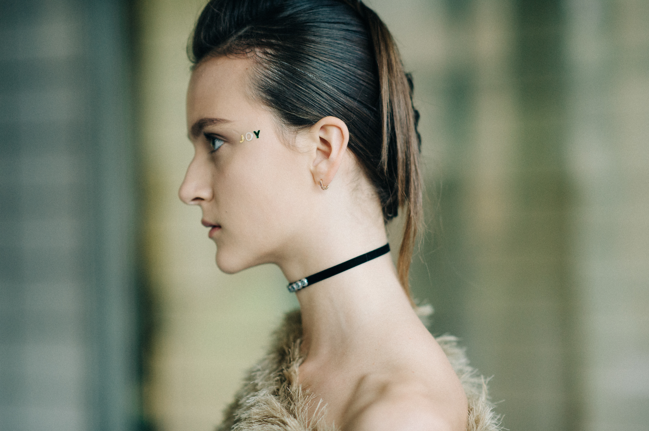 Model wearing make up before the show