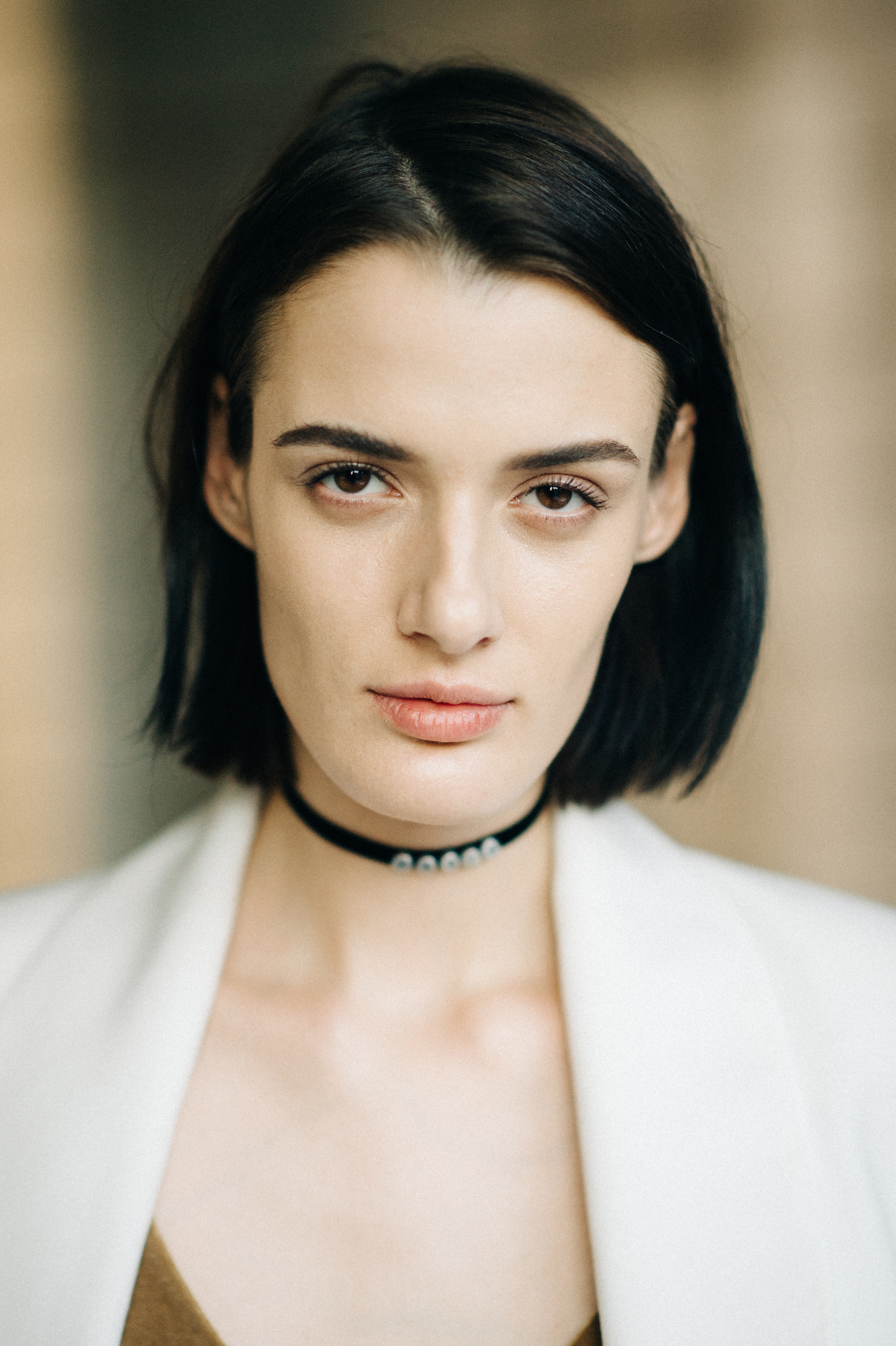 Portrait of Ukrainian model wearing make up with typeface before the show