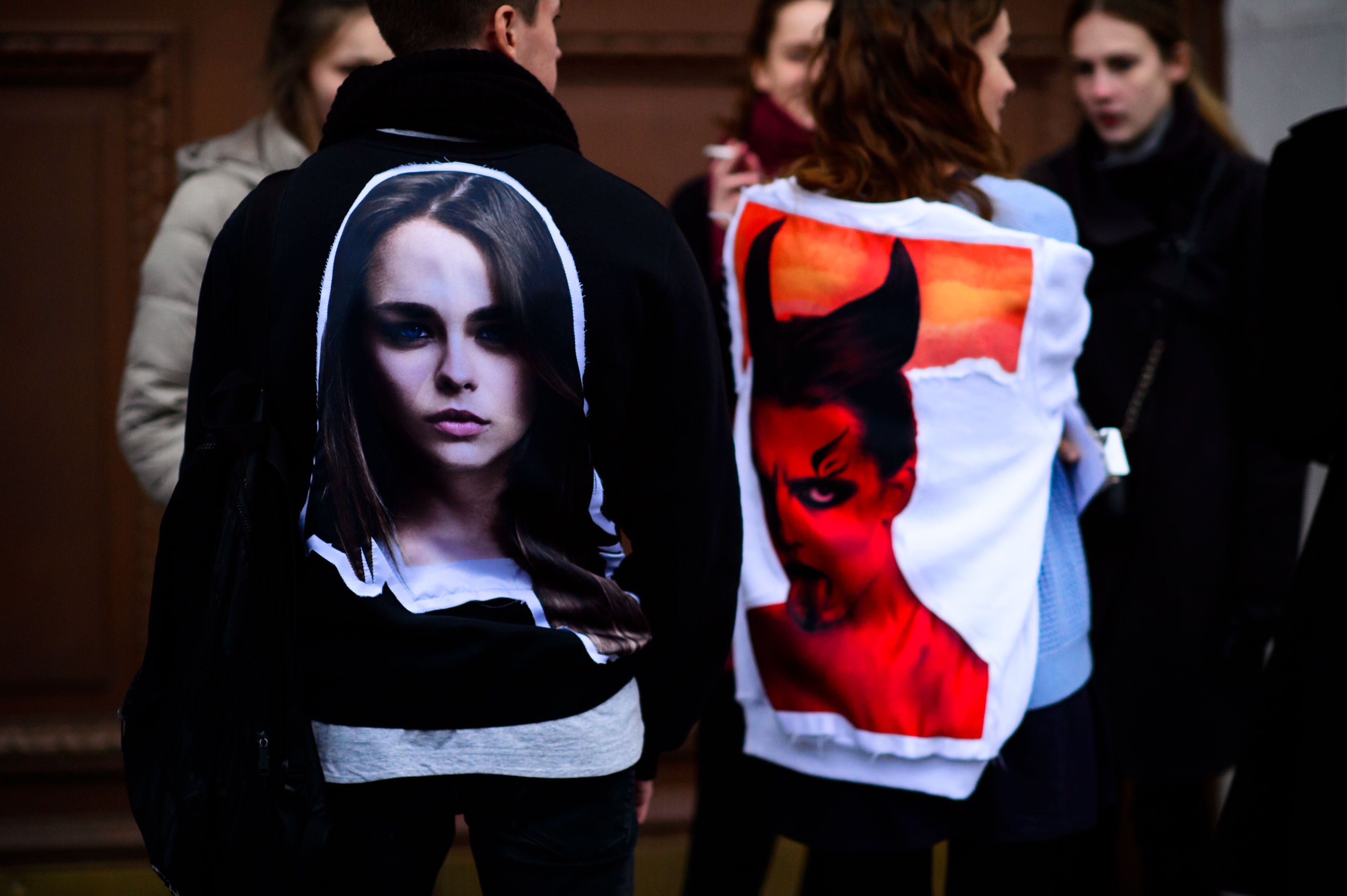Guys in two jackets with portrait prints