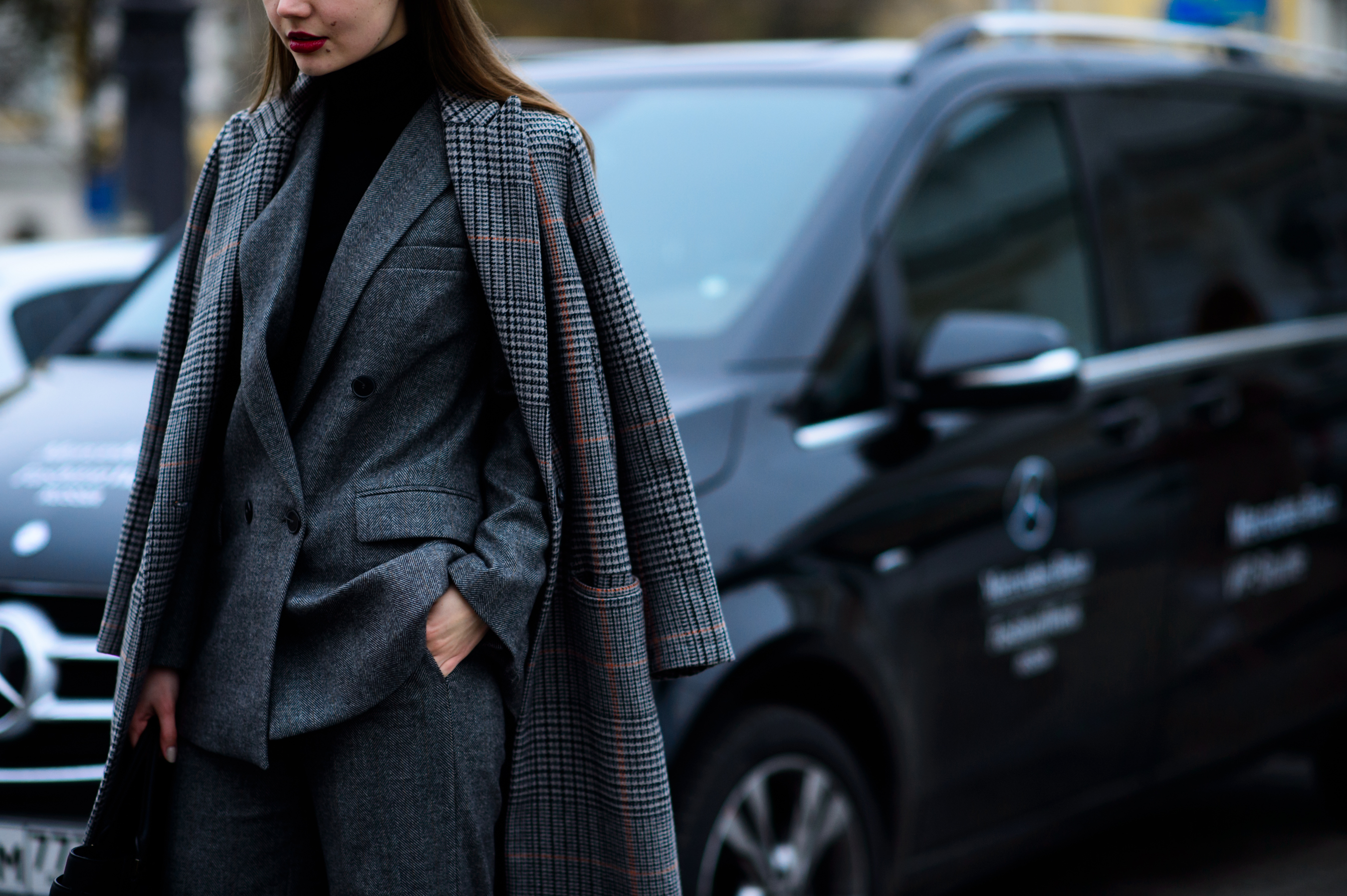 Russian blogger wearing gray suit