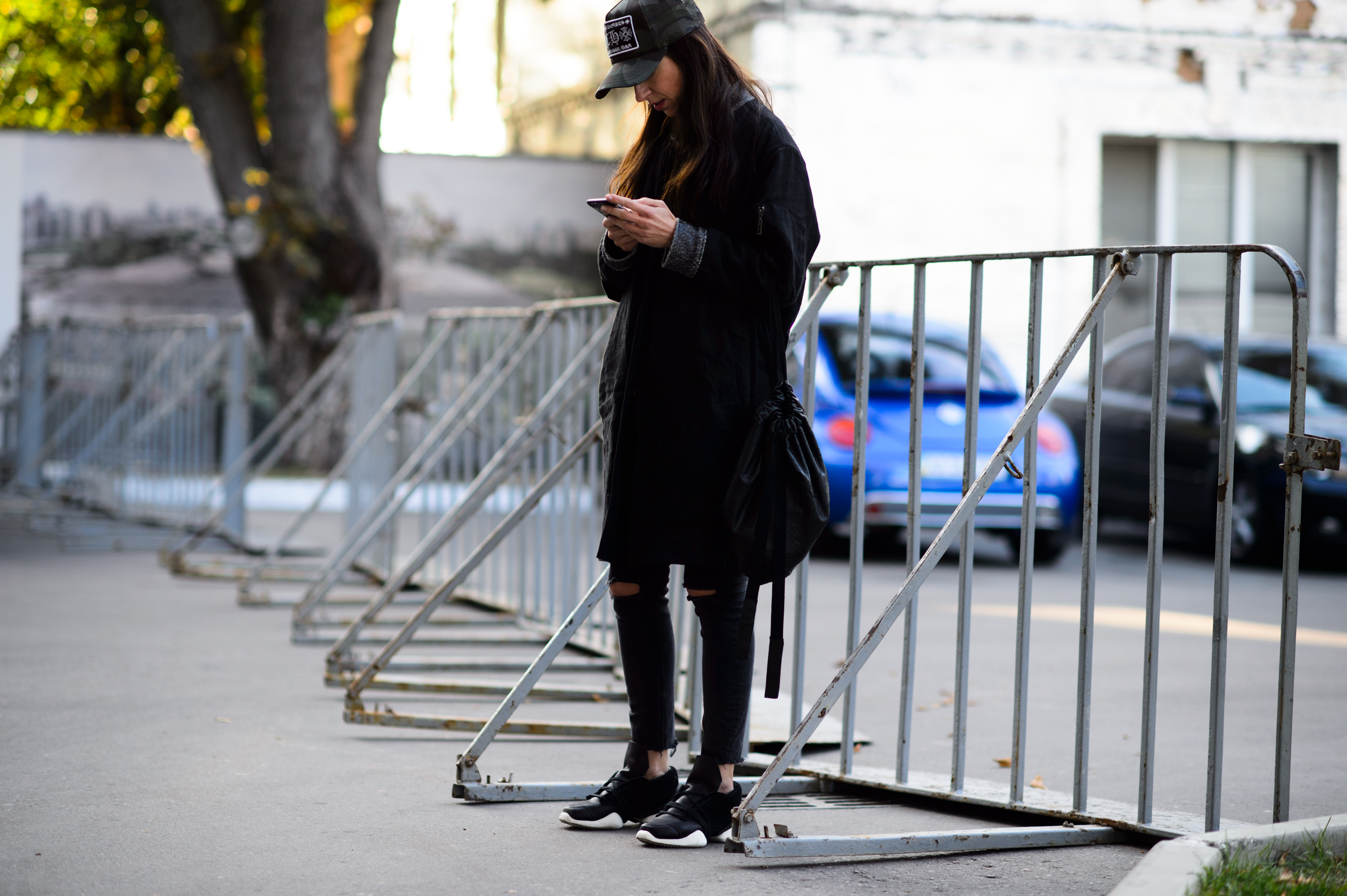 Girl wearing black sneakers and hat