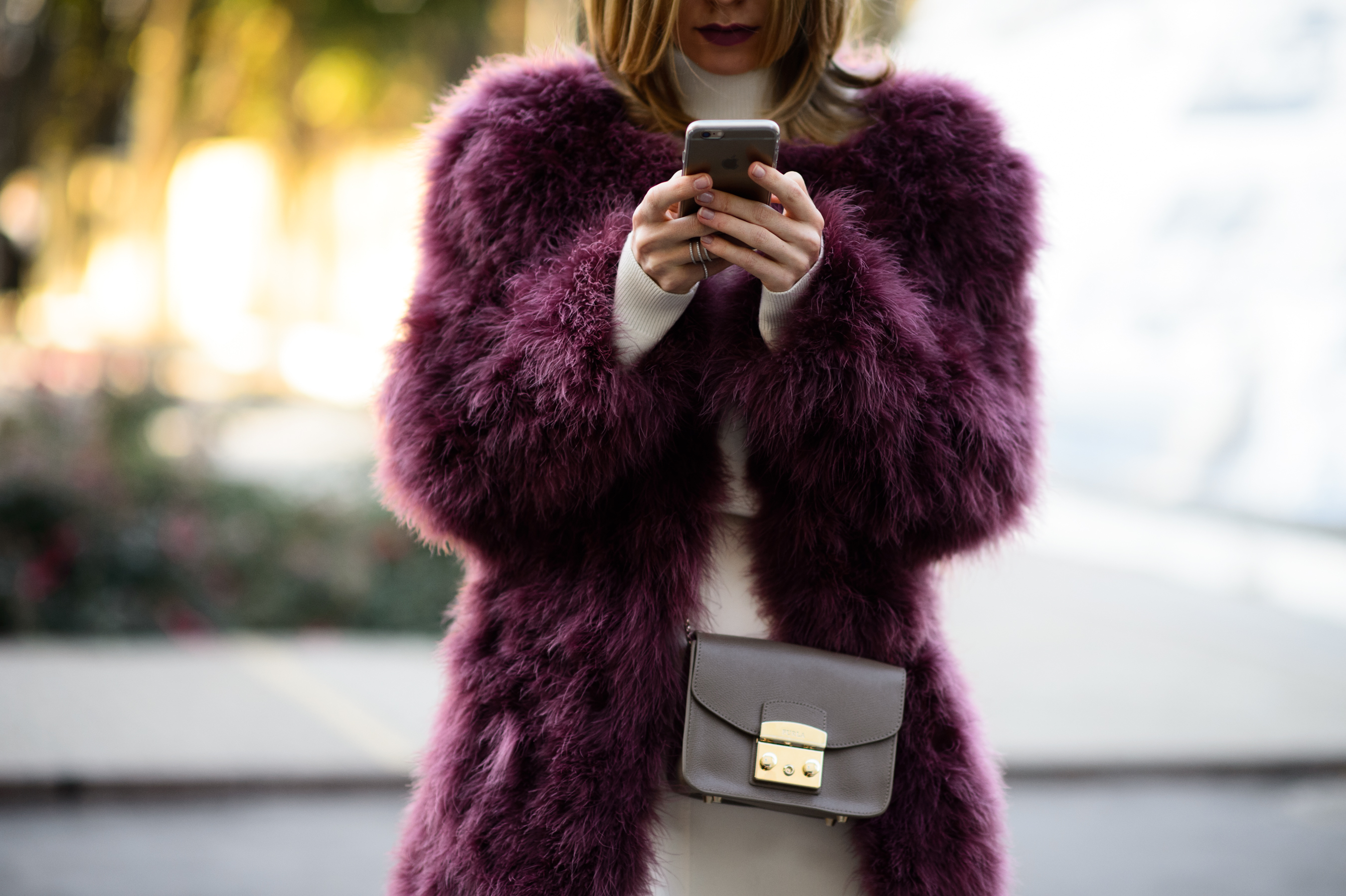 Girl wearing purple furcoat
