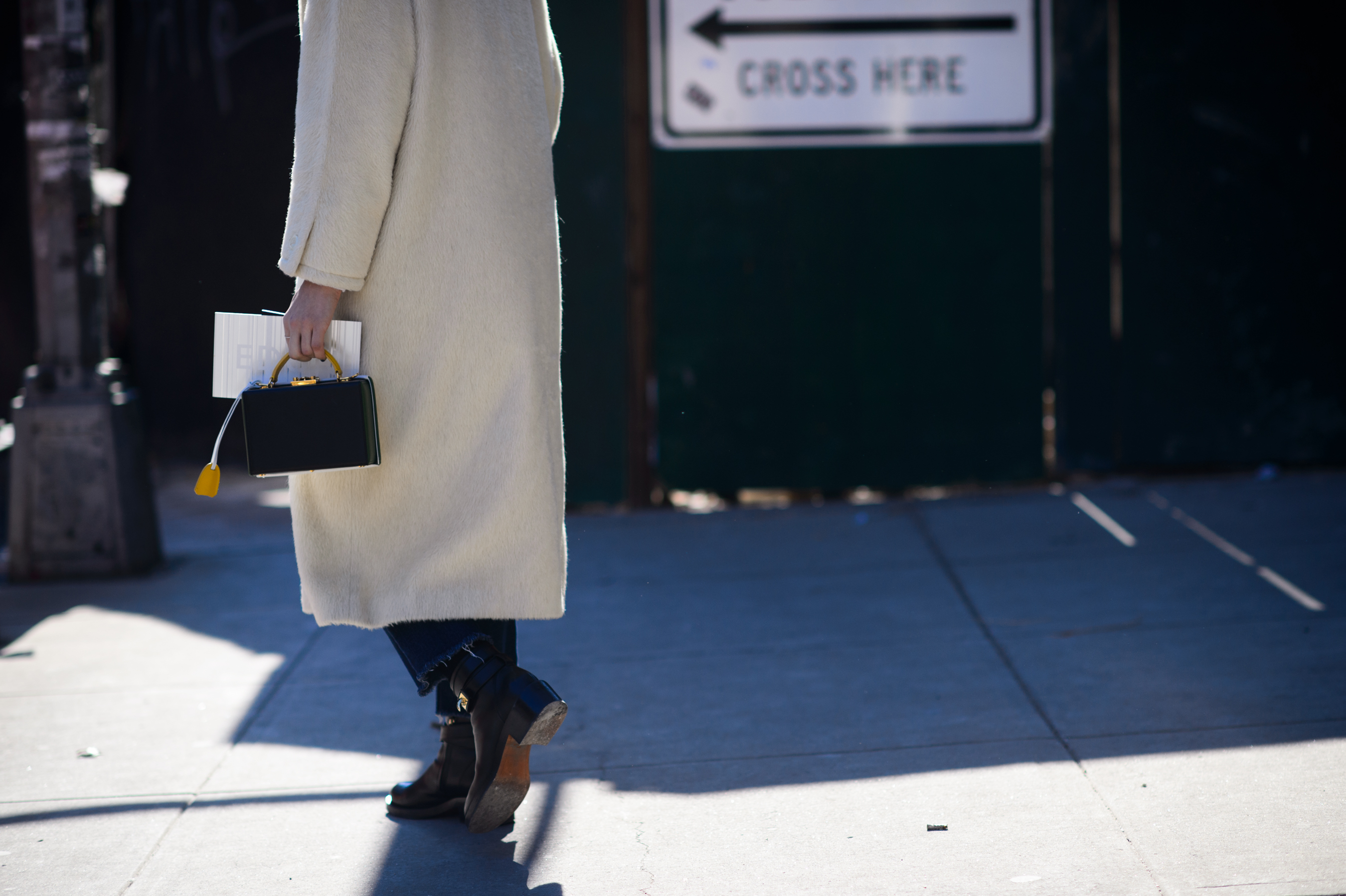 Woman wearing long white coat