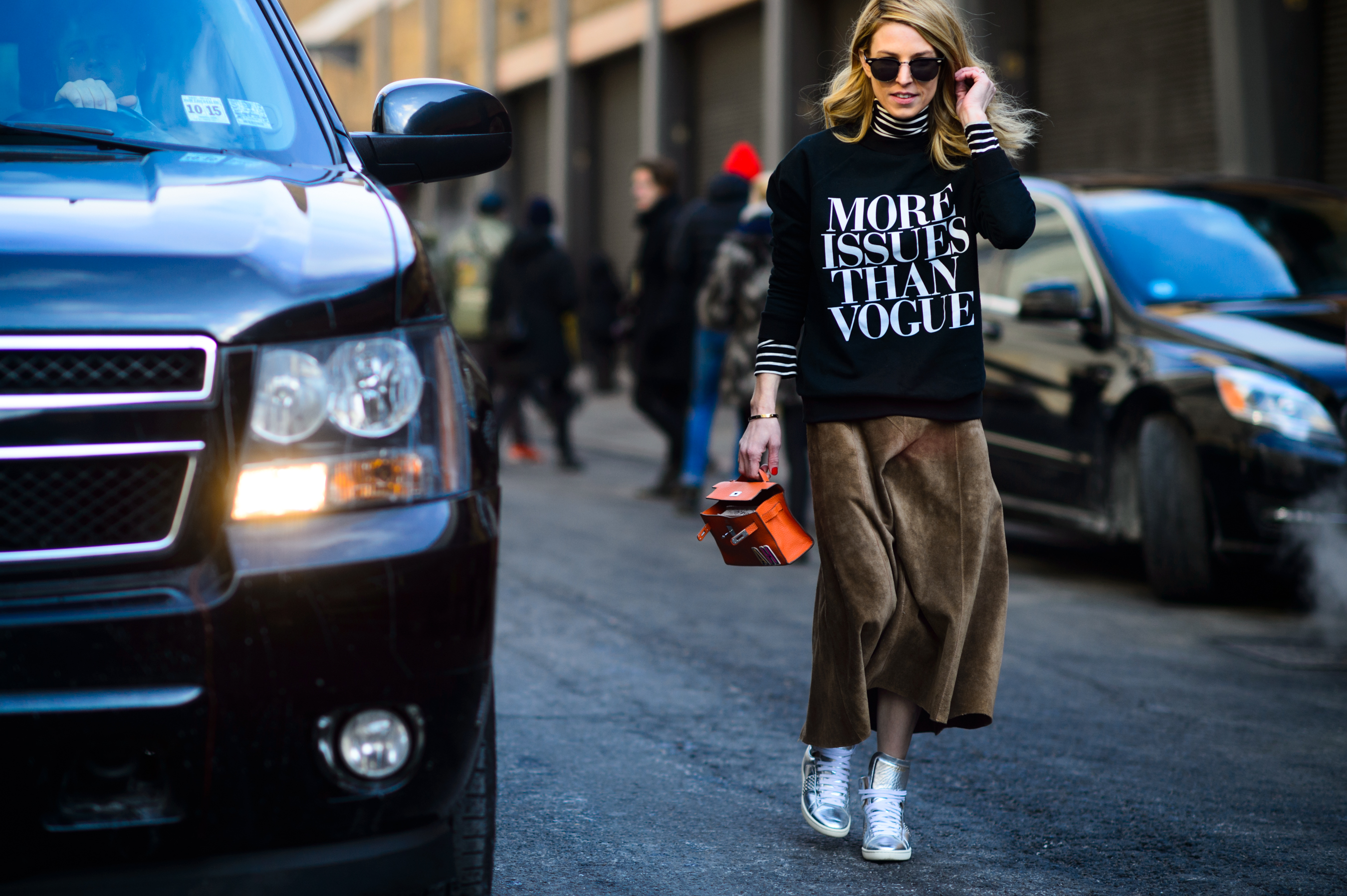 Girl wearing sweater with printed slogan