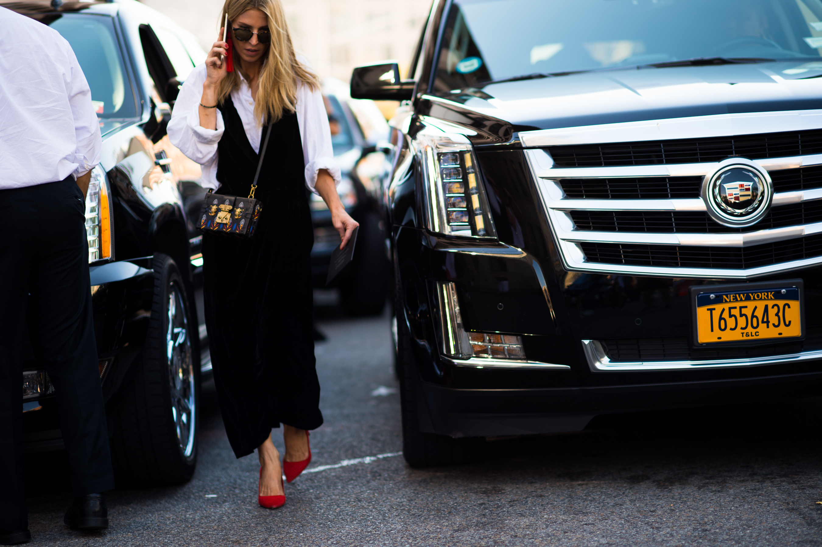 Woman wearing black dress over the shirt
