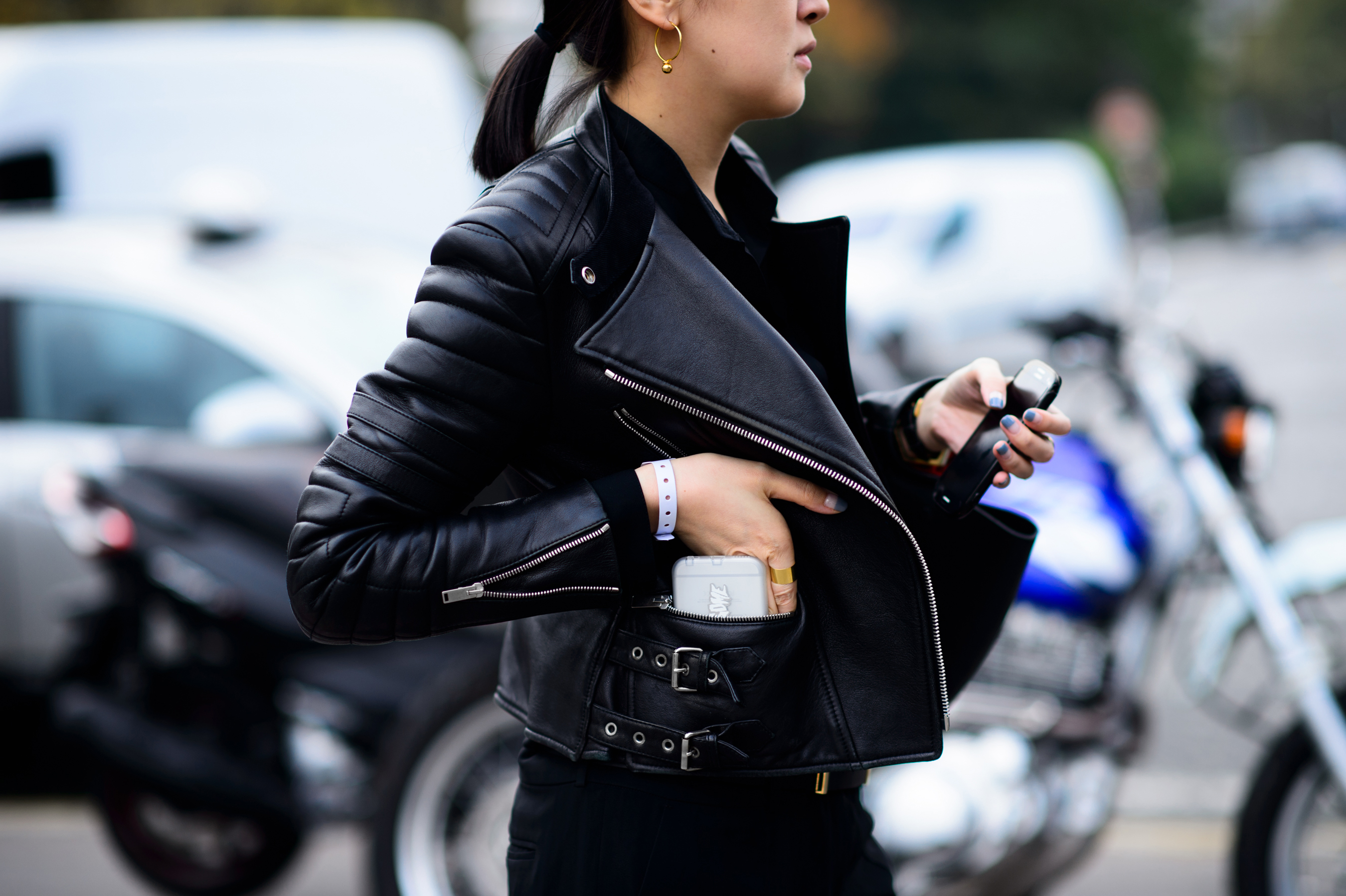 Woman reaching into her pocket