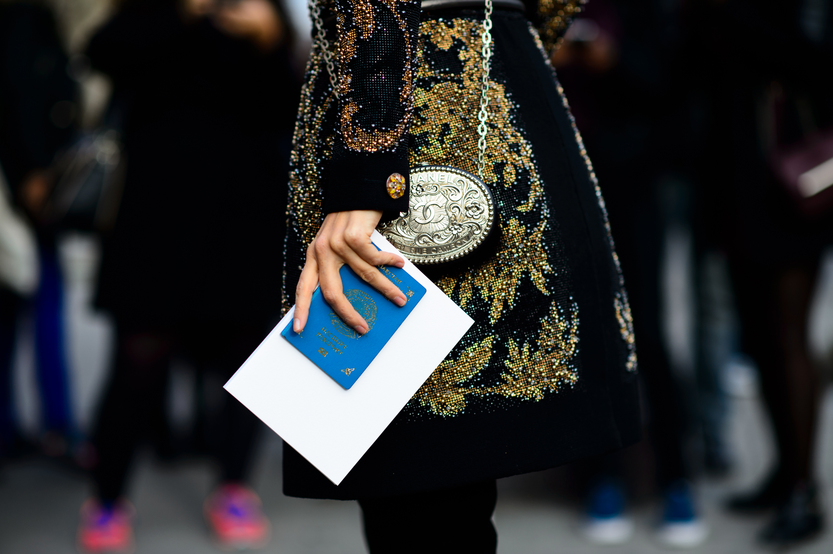Woman holding Kazakh passport in her hand