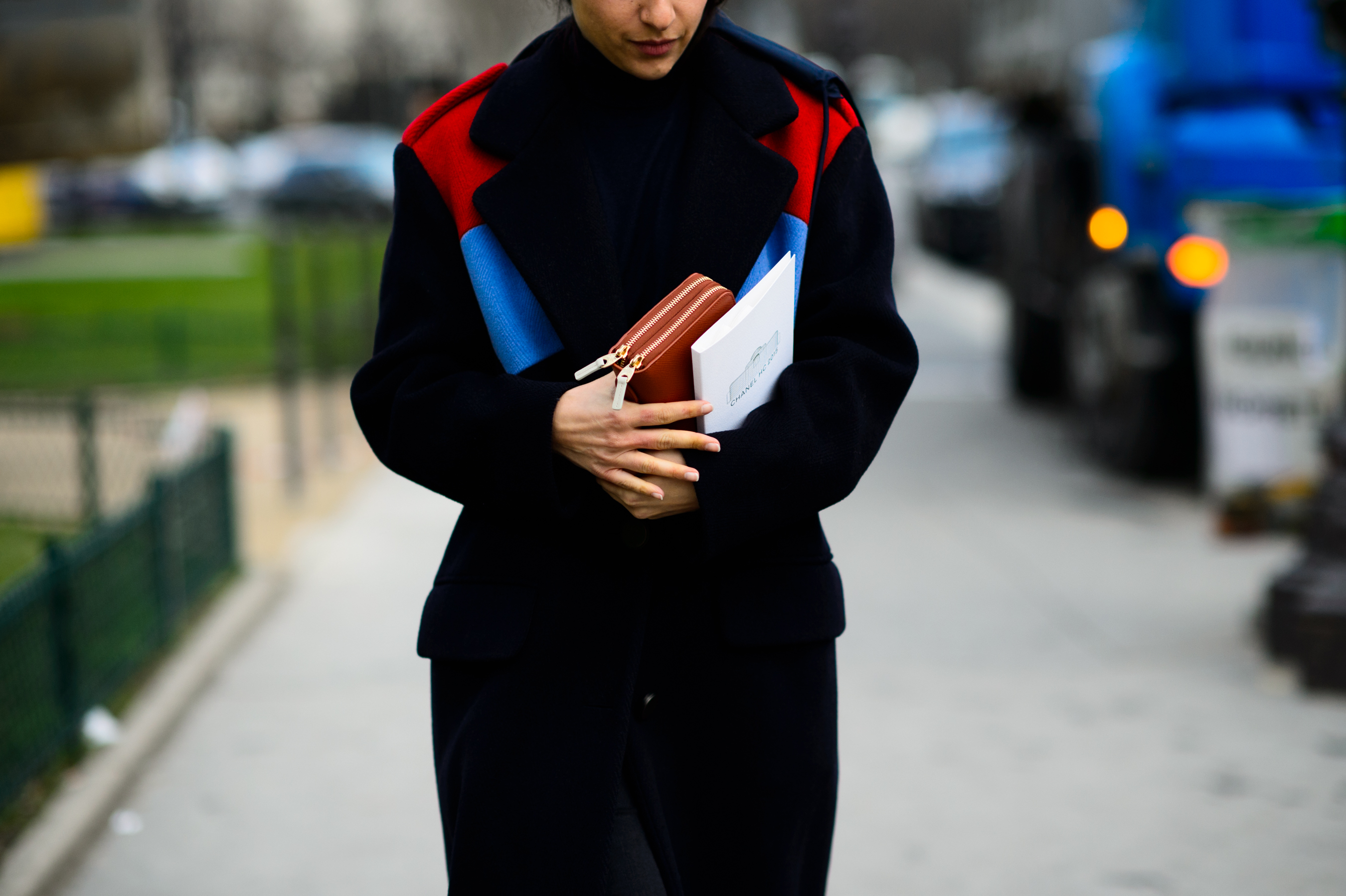 Woman wearing coat with colorful detail