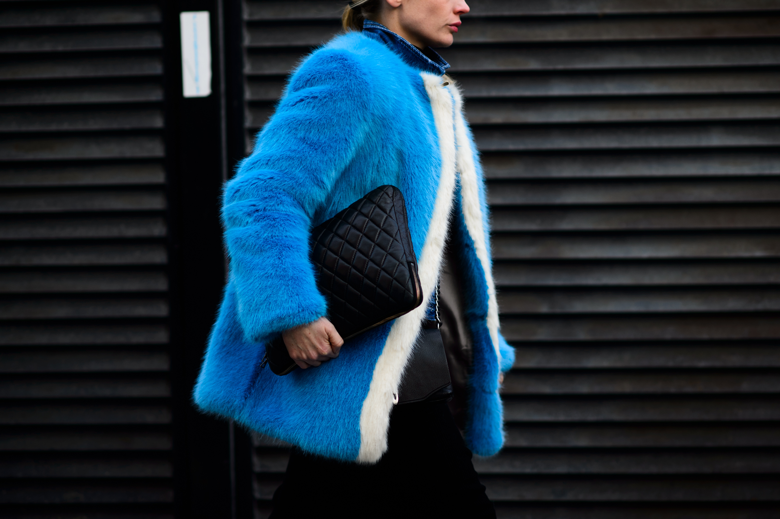 Woman wearing blue fur coat