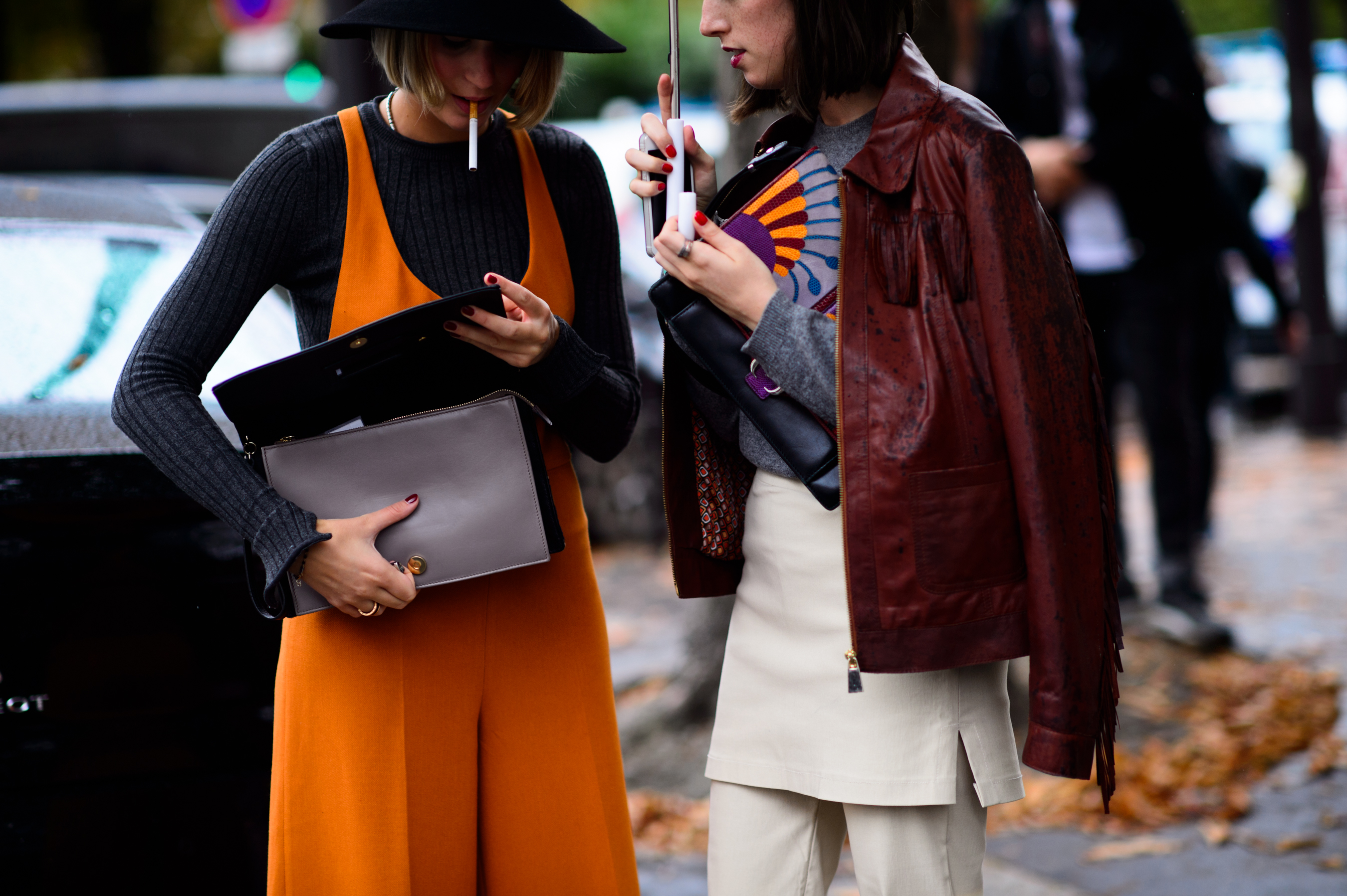 Two women smoking after the show
