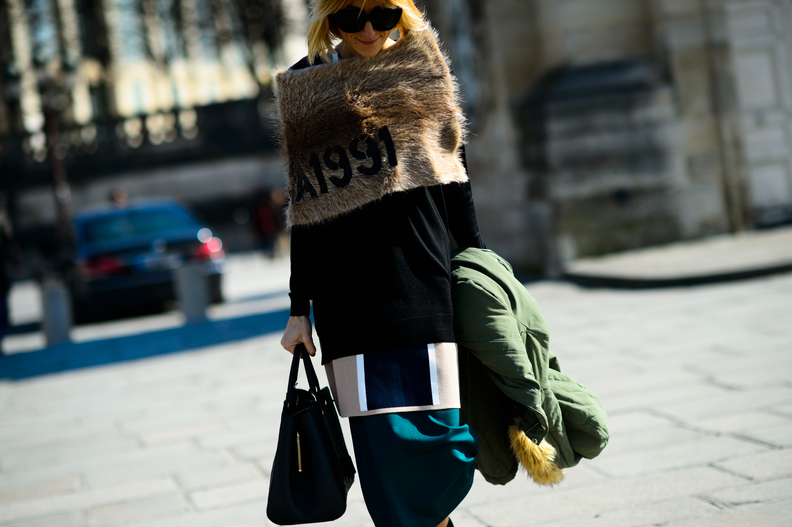 Woman wearing furry cape after the show