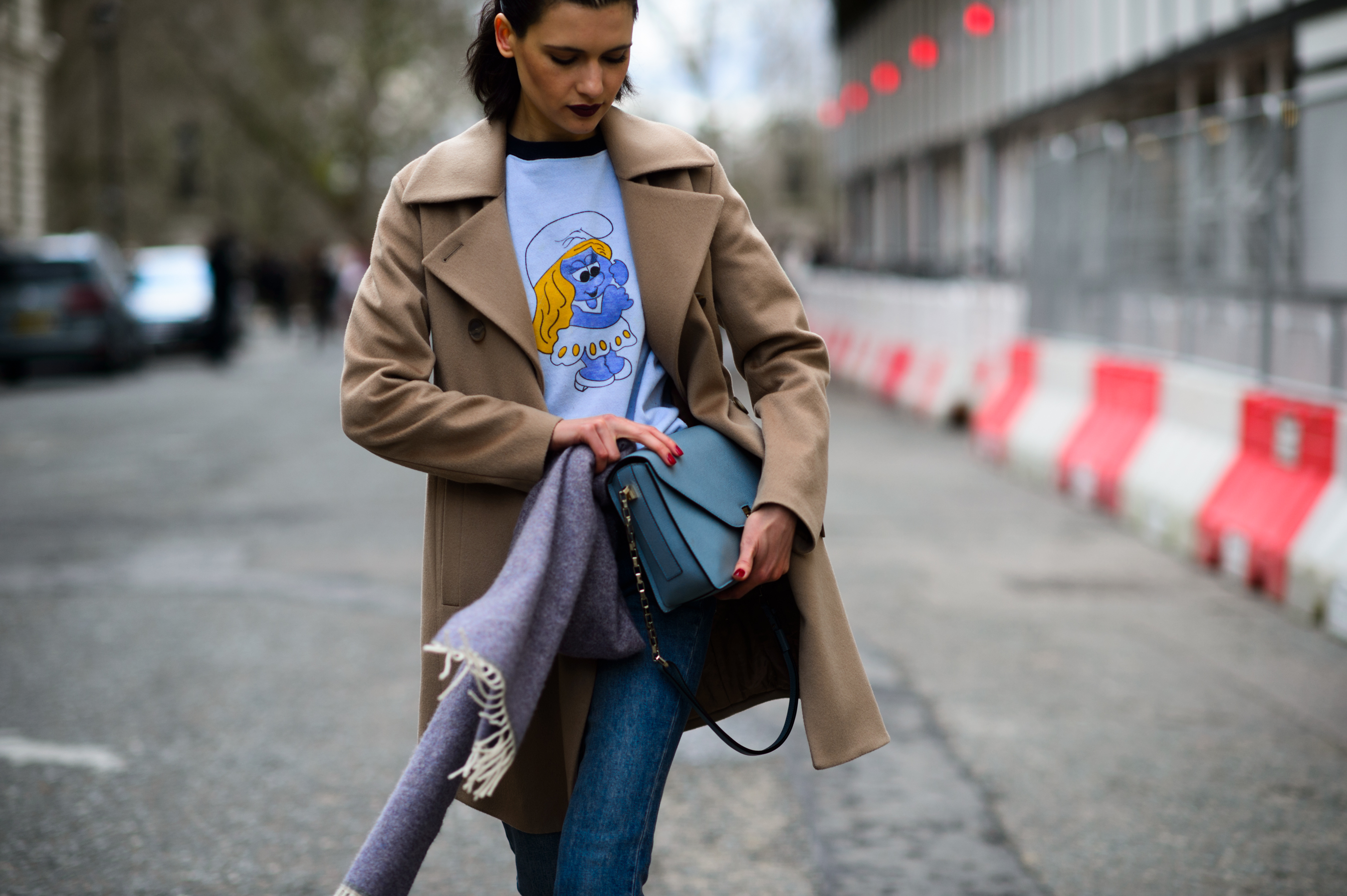 Model wearing Smurf t-shirt and dark lipstick