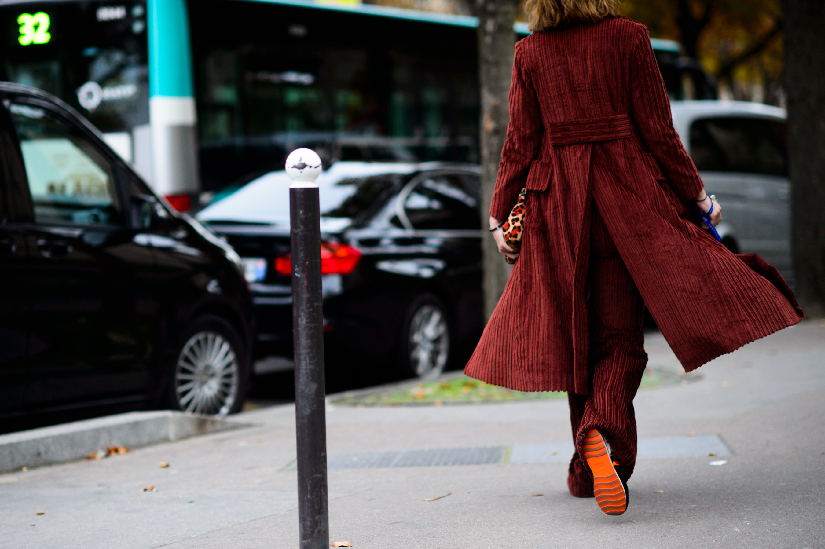 Woman in red coat leaving the show