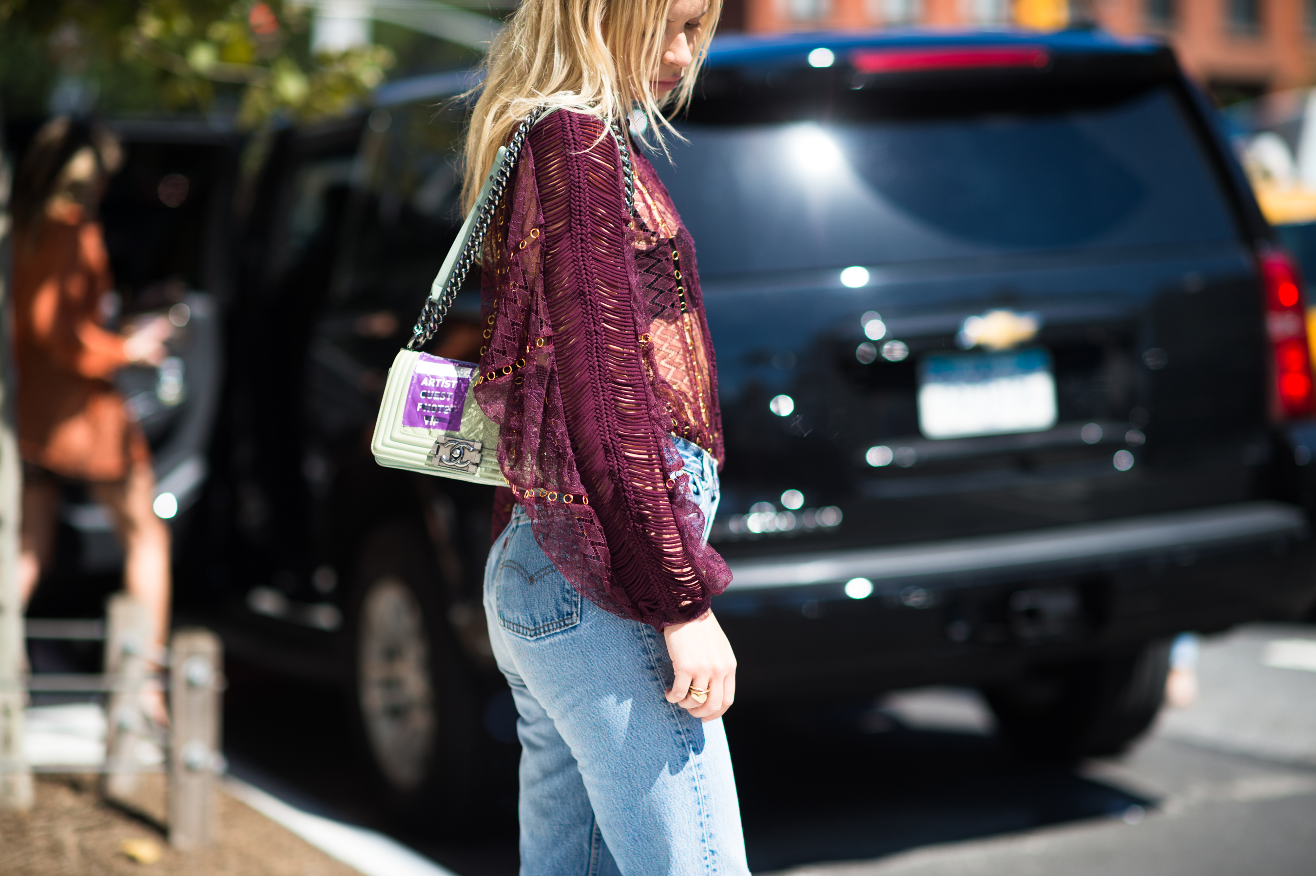 Woman wearing sheer burgundy blowse