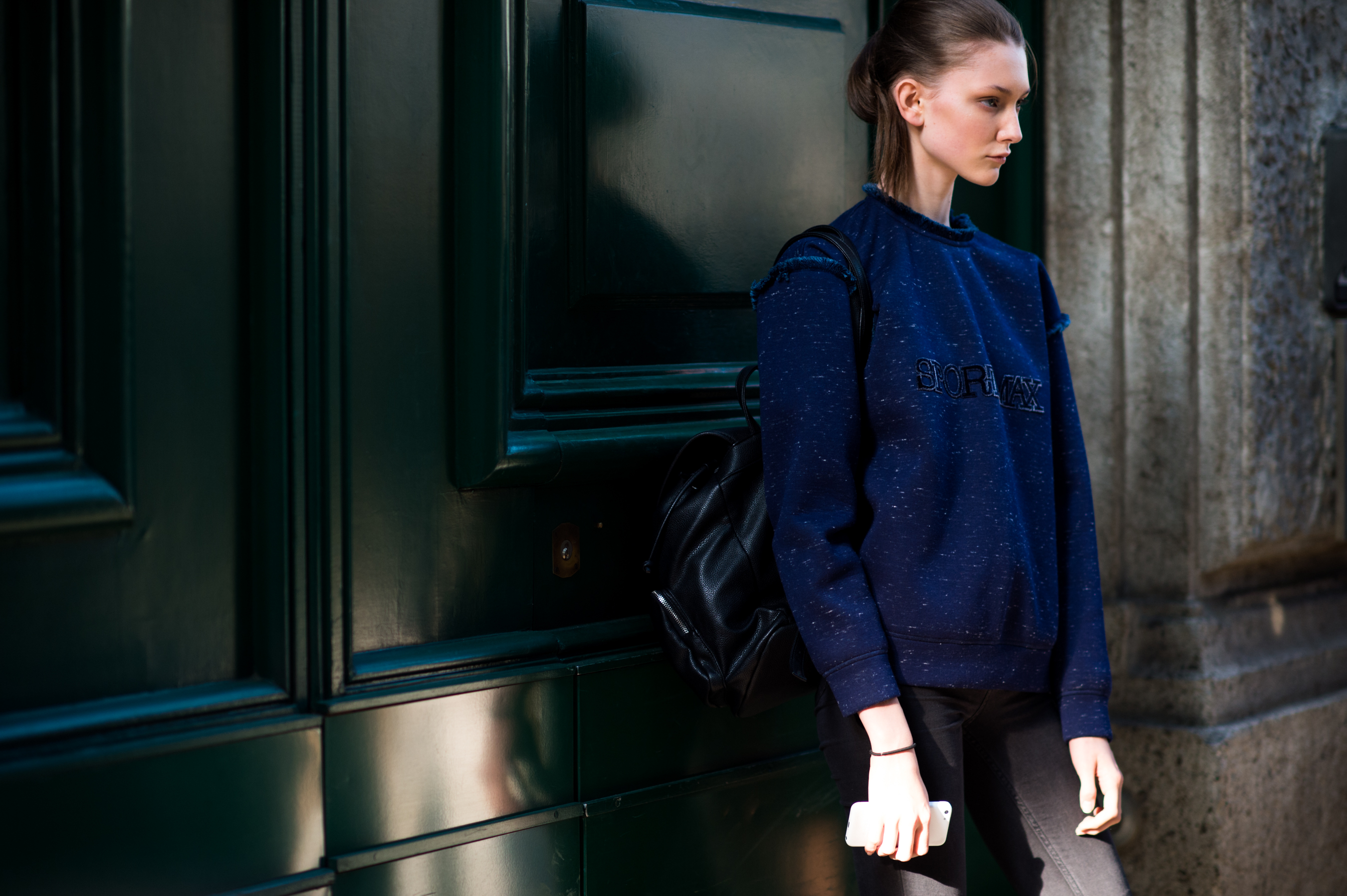 Model wearing blue sweatshirt