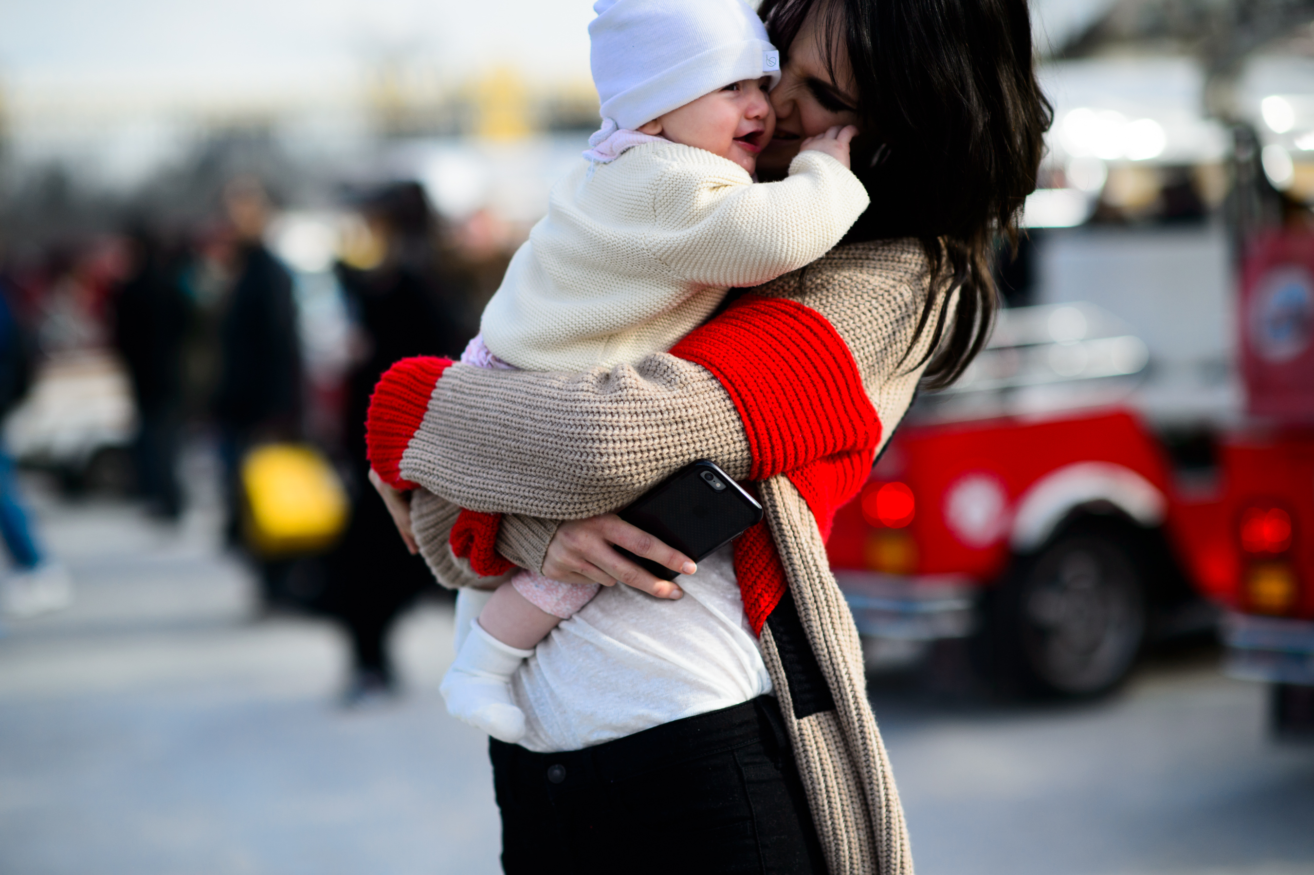 Model holding her baby after the show