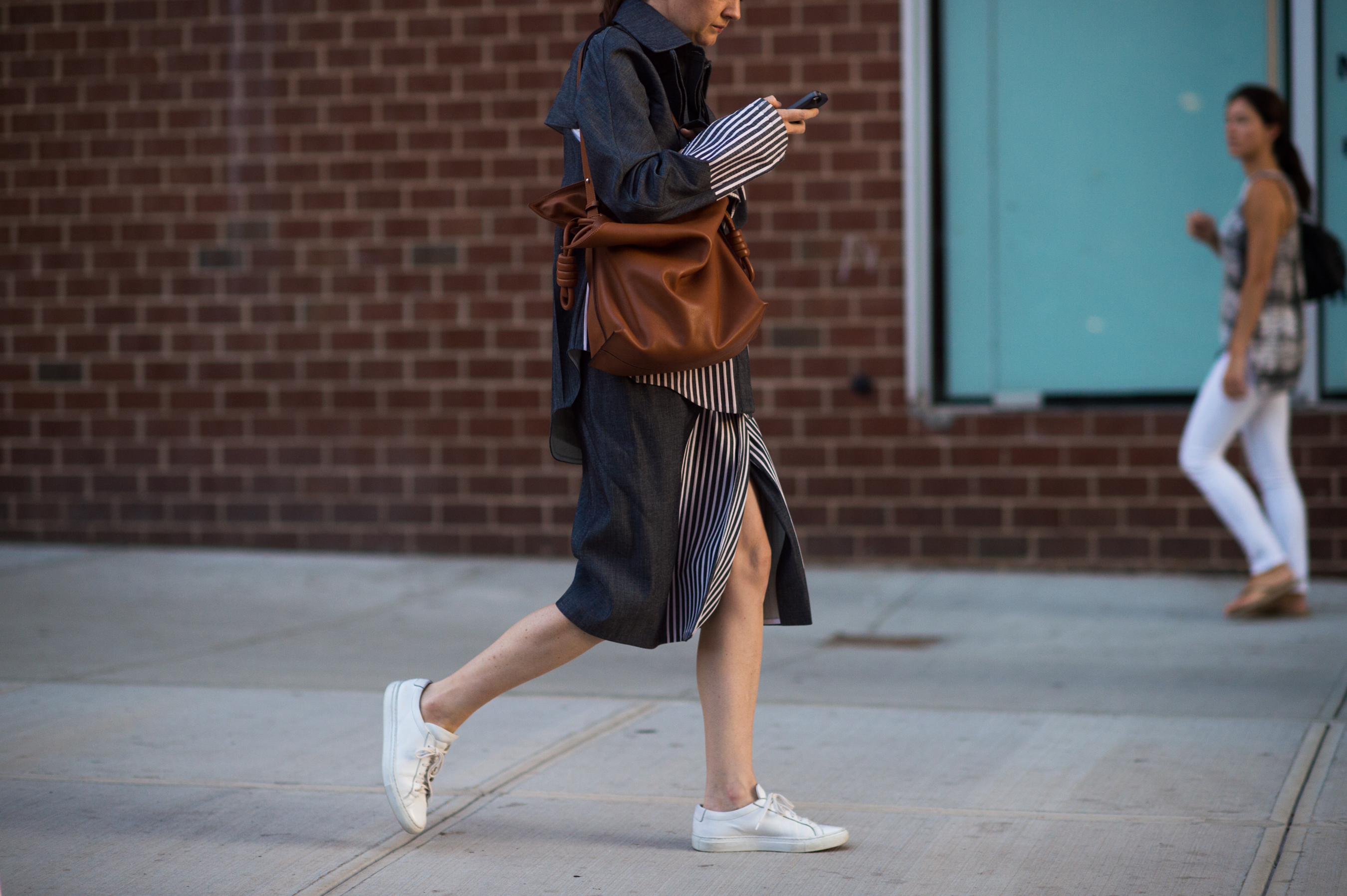 Woman wearing suit with stipe inserts
