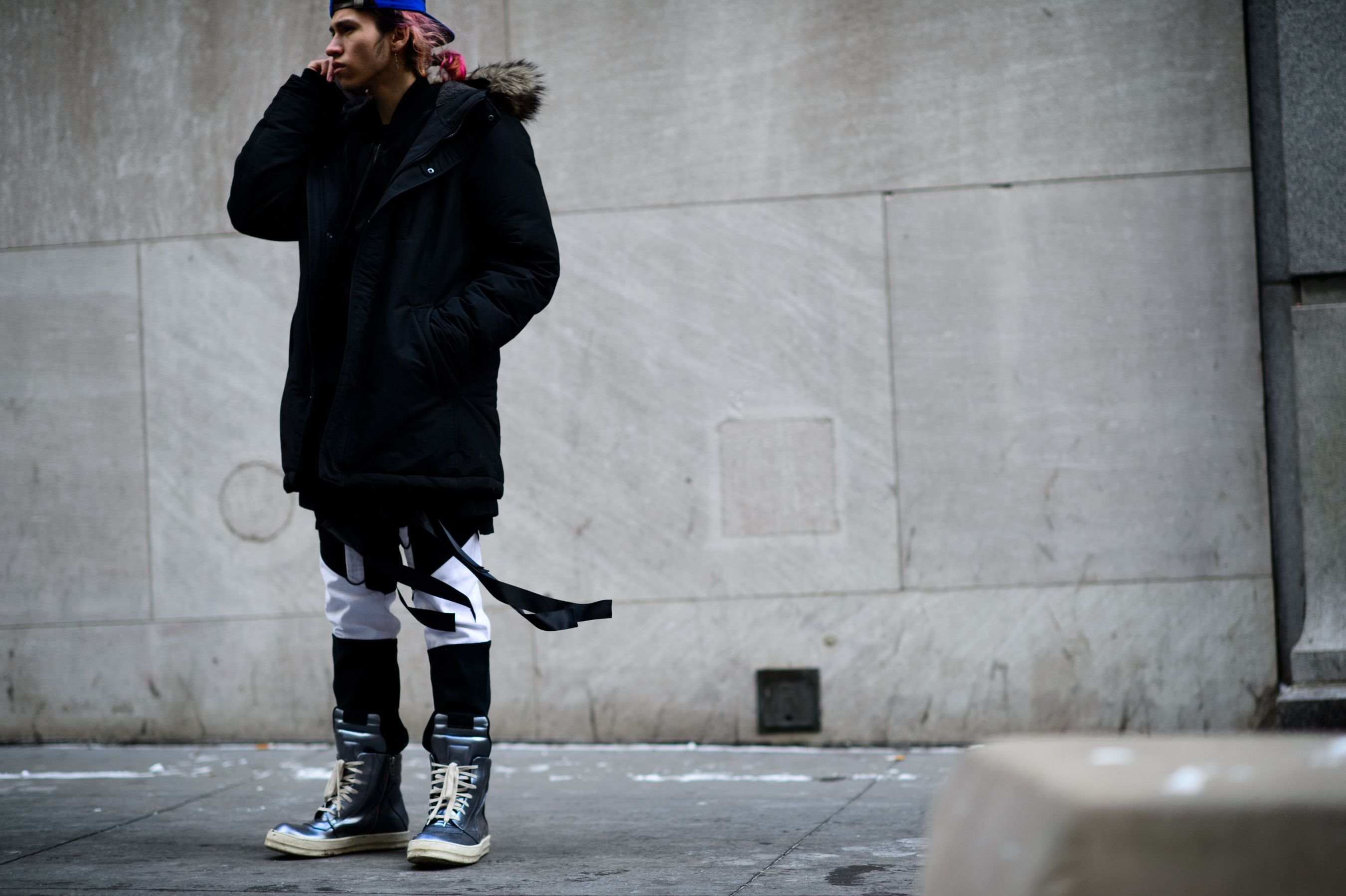 Man with pink hair and puffy jacket