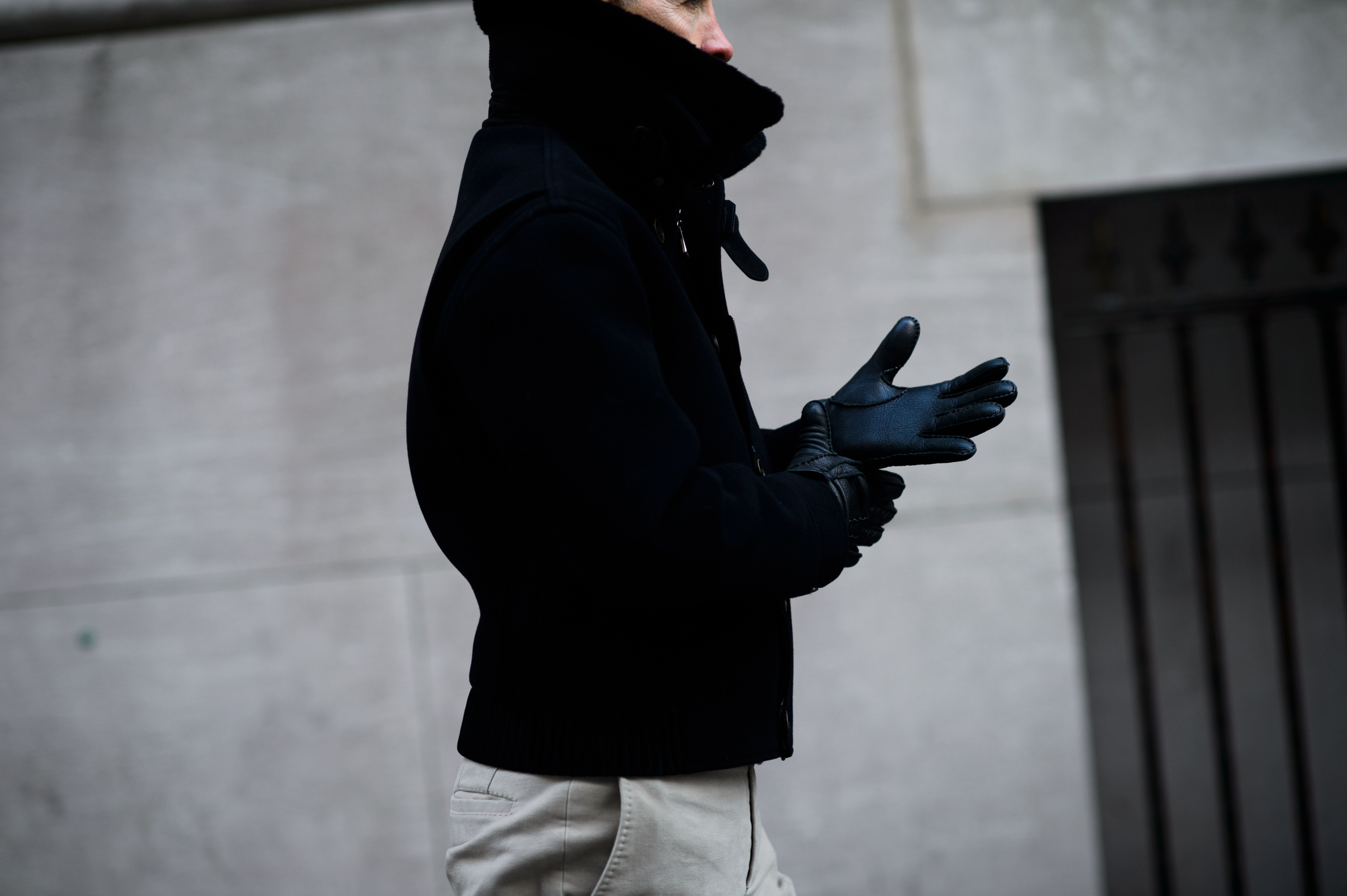 Woman wearing warm jacket and leather gloves
