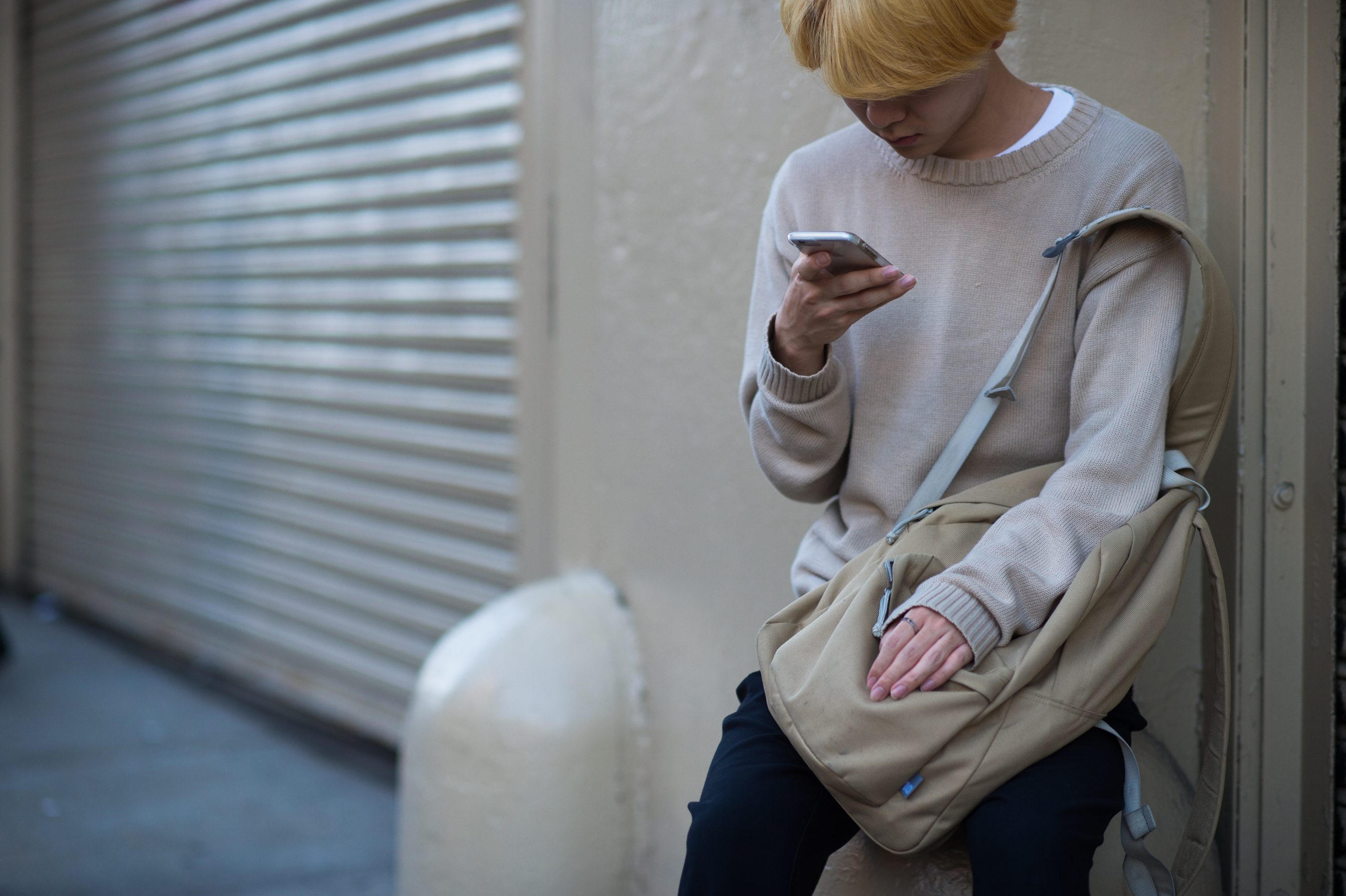 Man in beige sweater