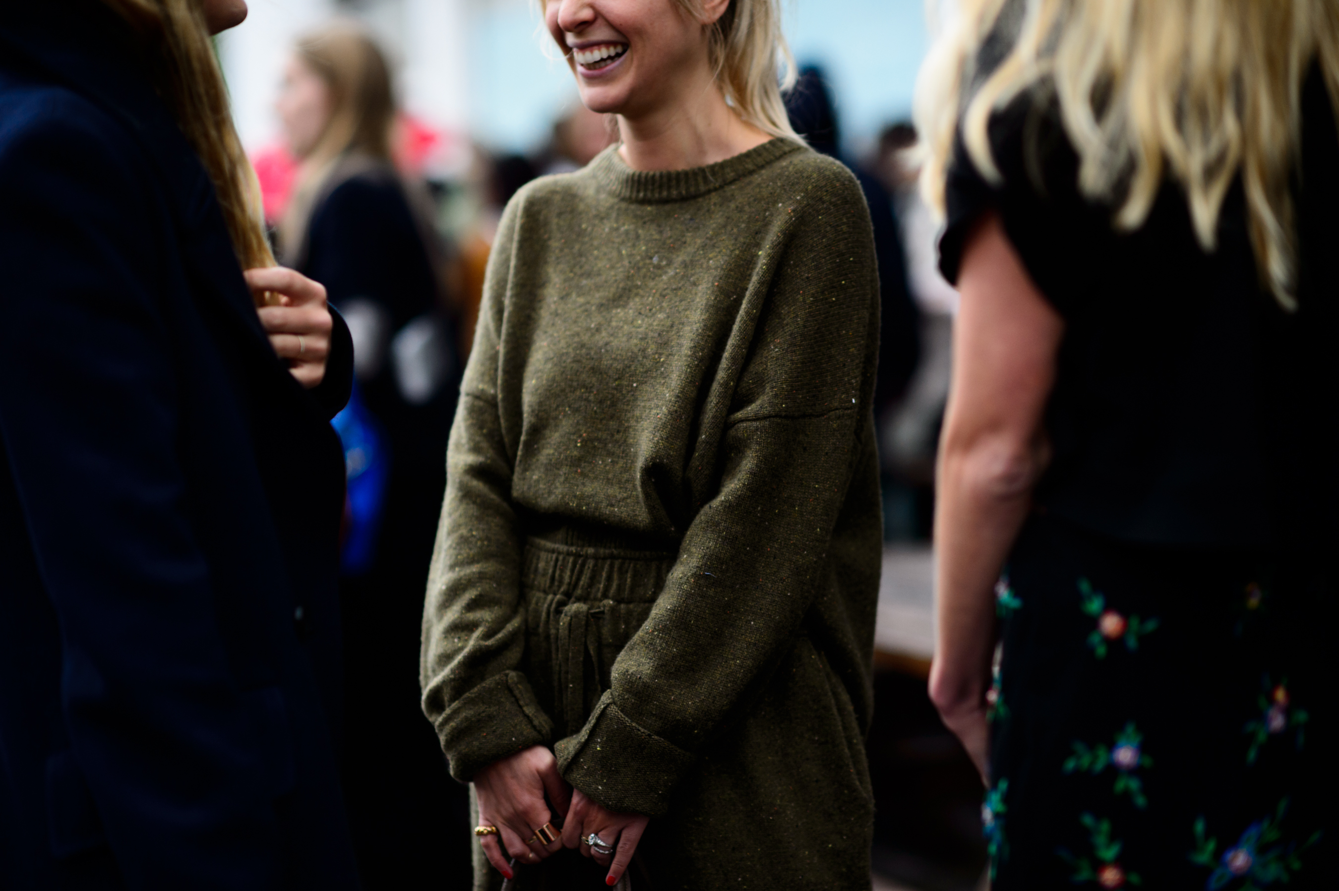 Woman in khaki knitwear suit