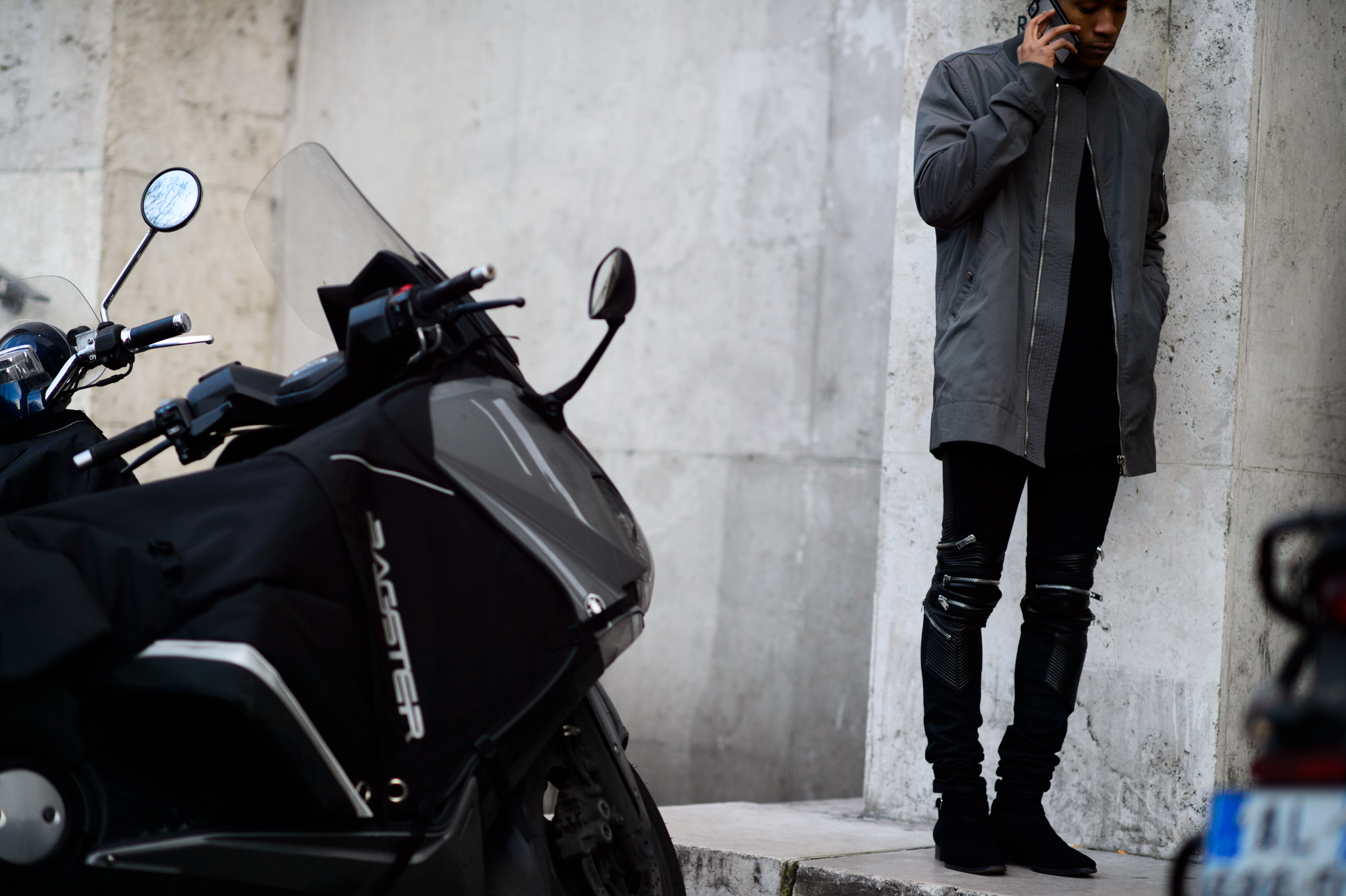 Man wearing black jeans with zippers
