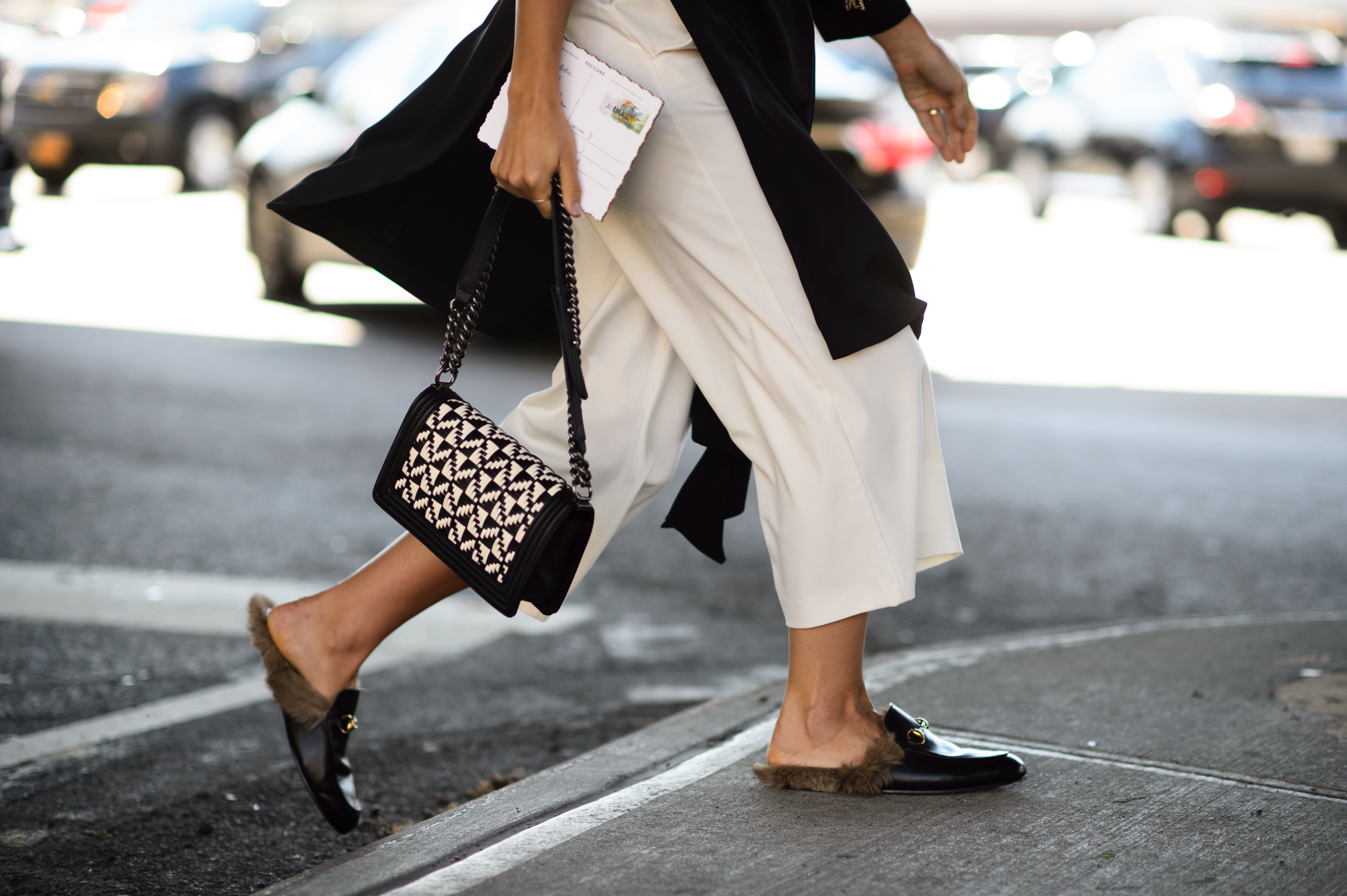 Woman wearing furry loafers