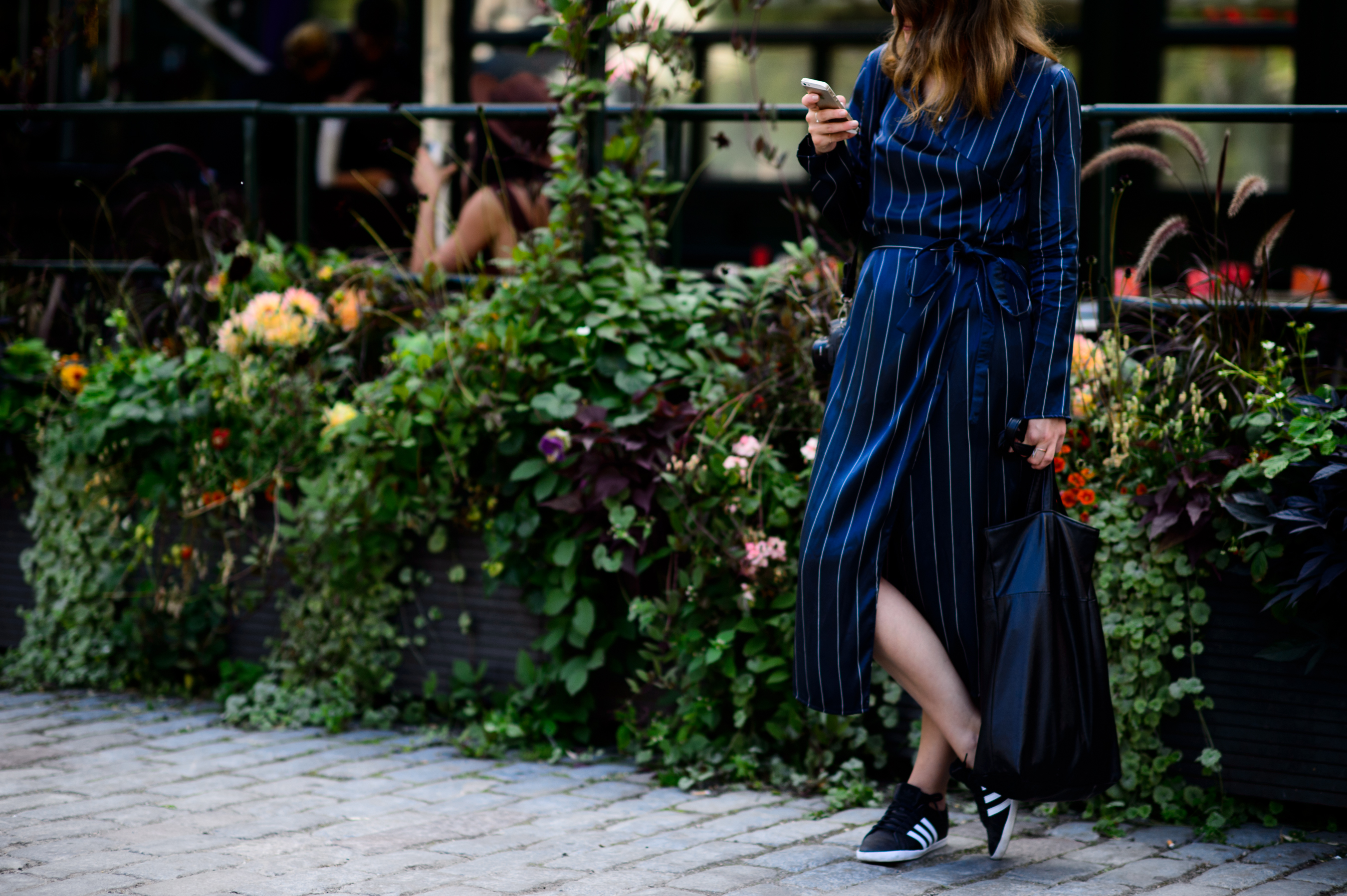 Woman wearing silk dress with stripes