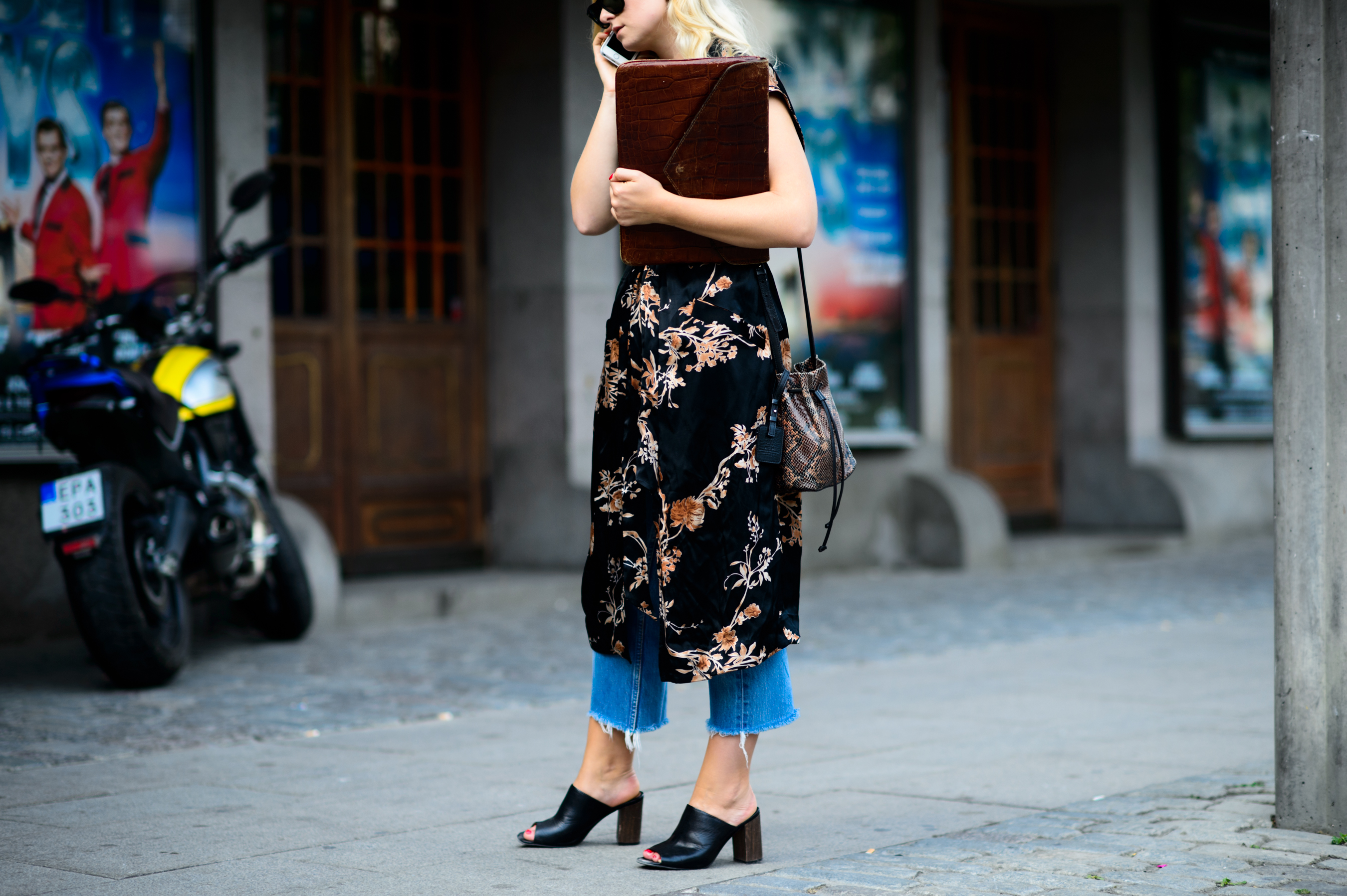 Woman wearing dress with jeans