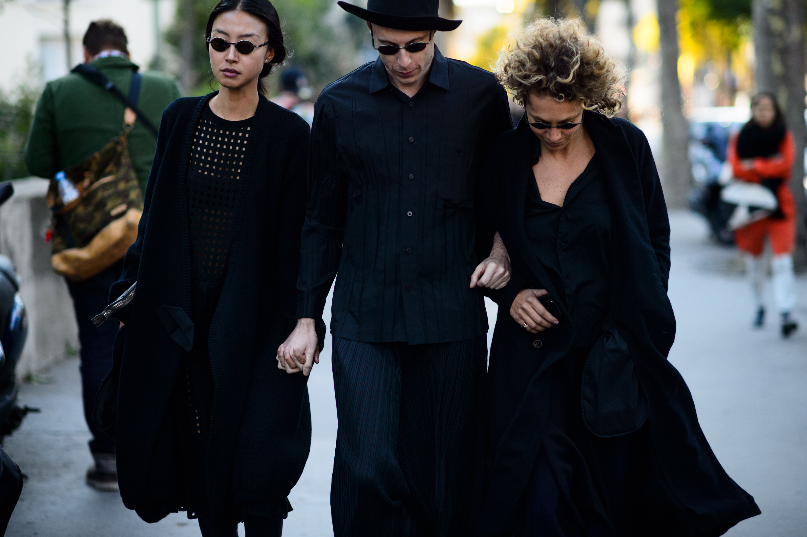 Three people wearing black after the show