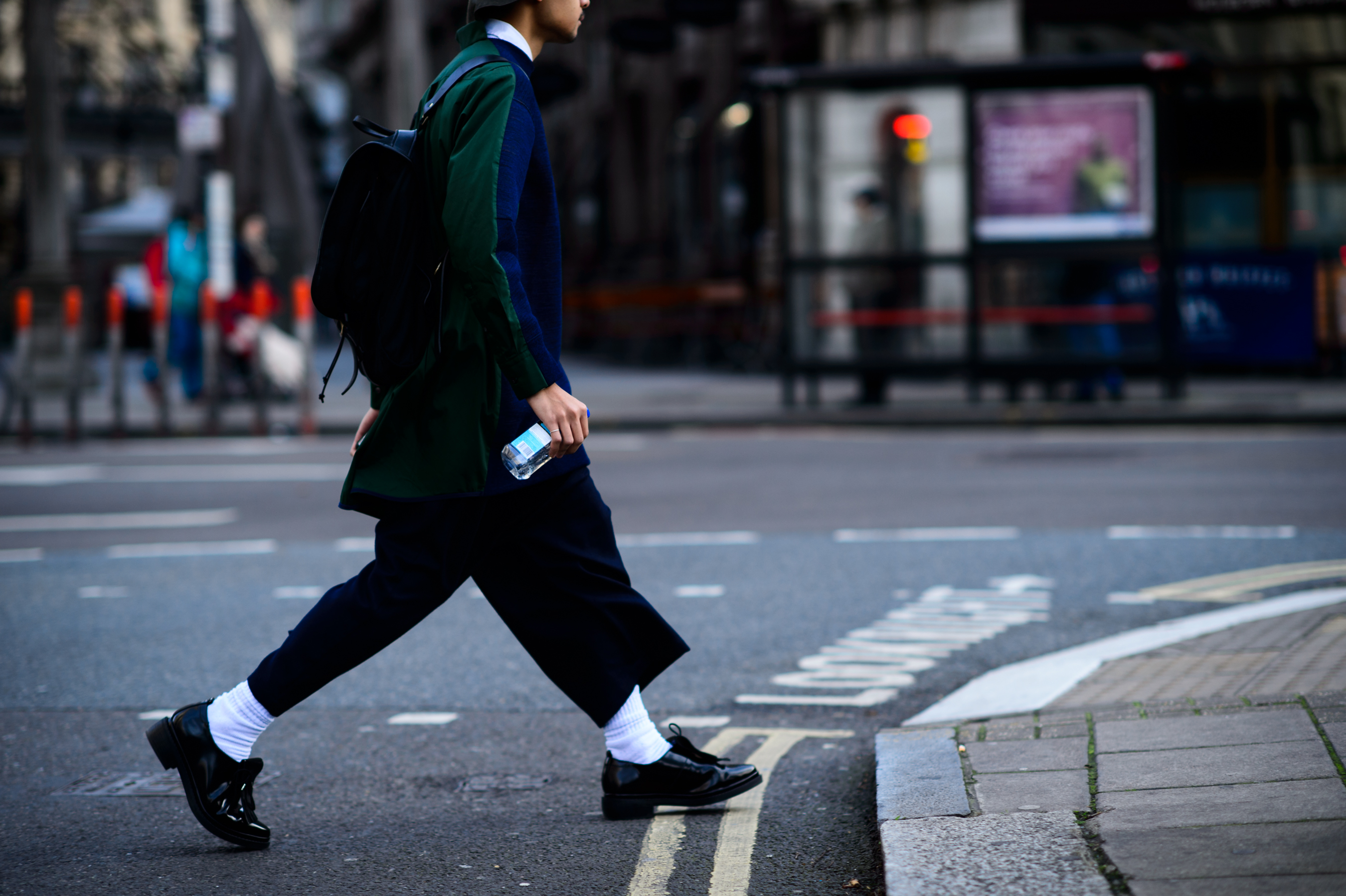 Man wearing green and blue jacket