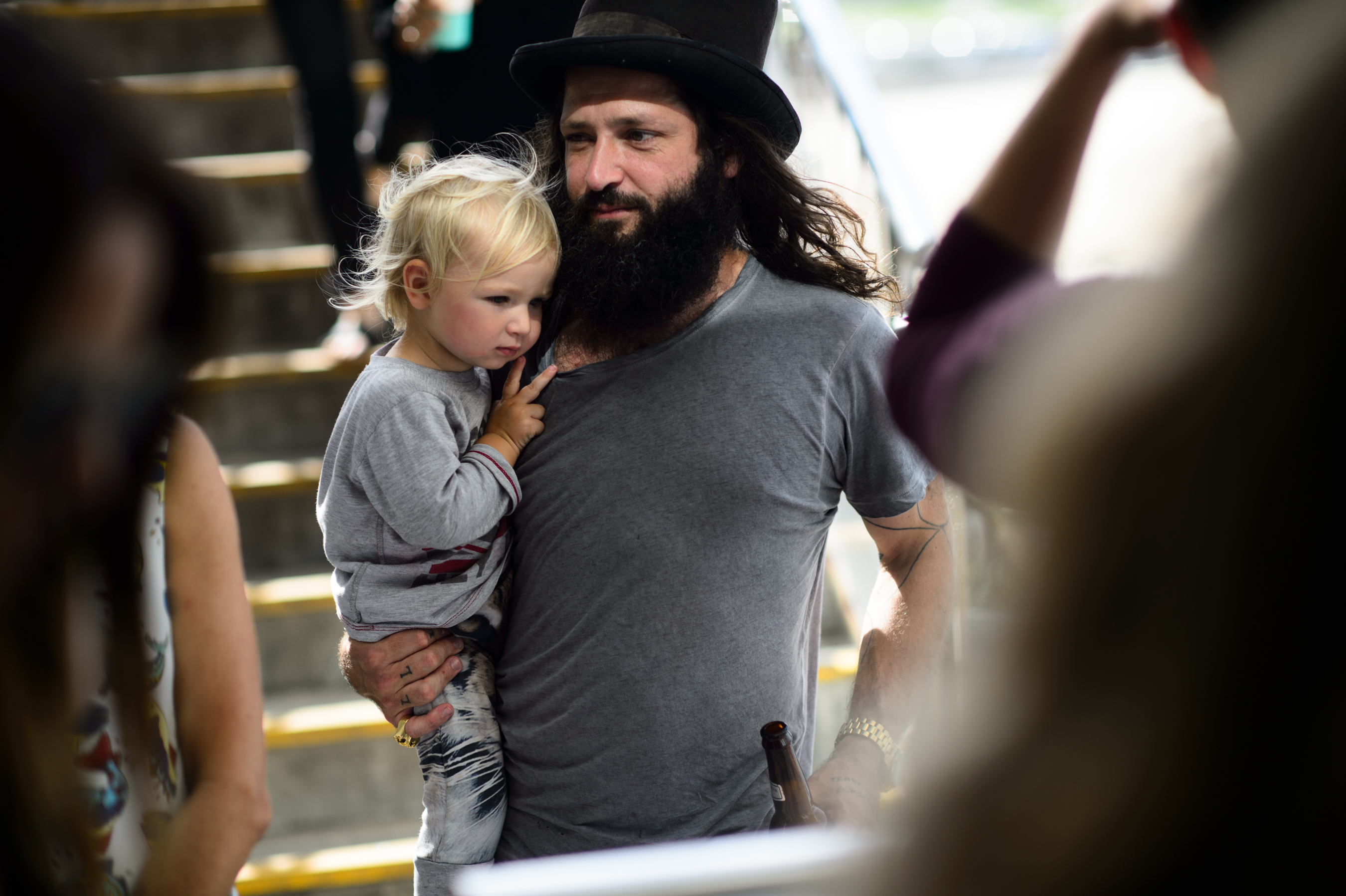 Man with beard holding a baby