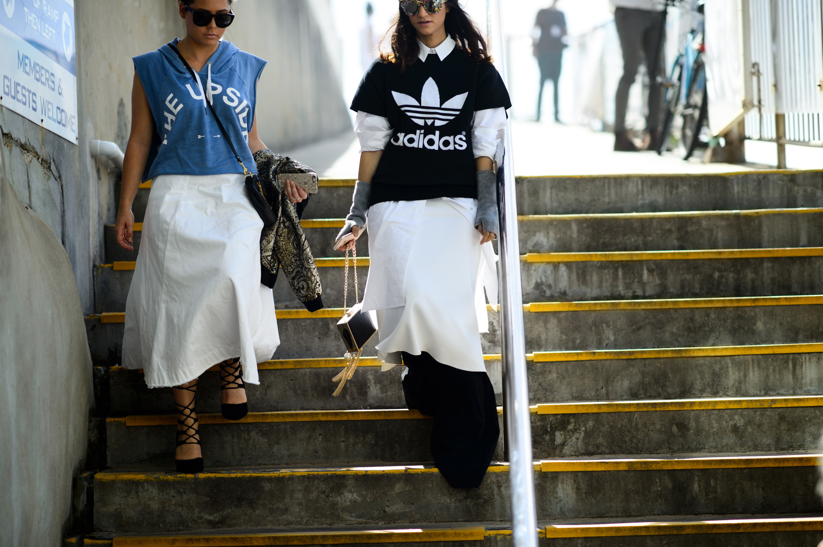 Two women n white skirts after the show