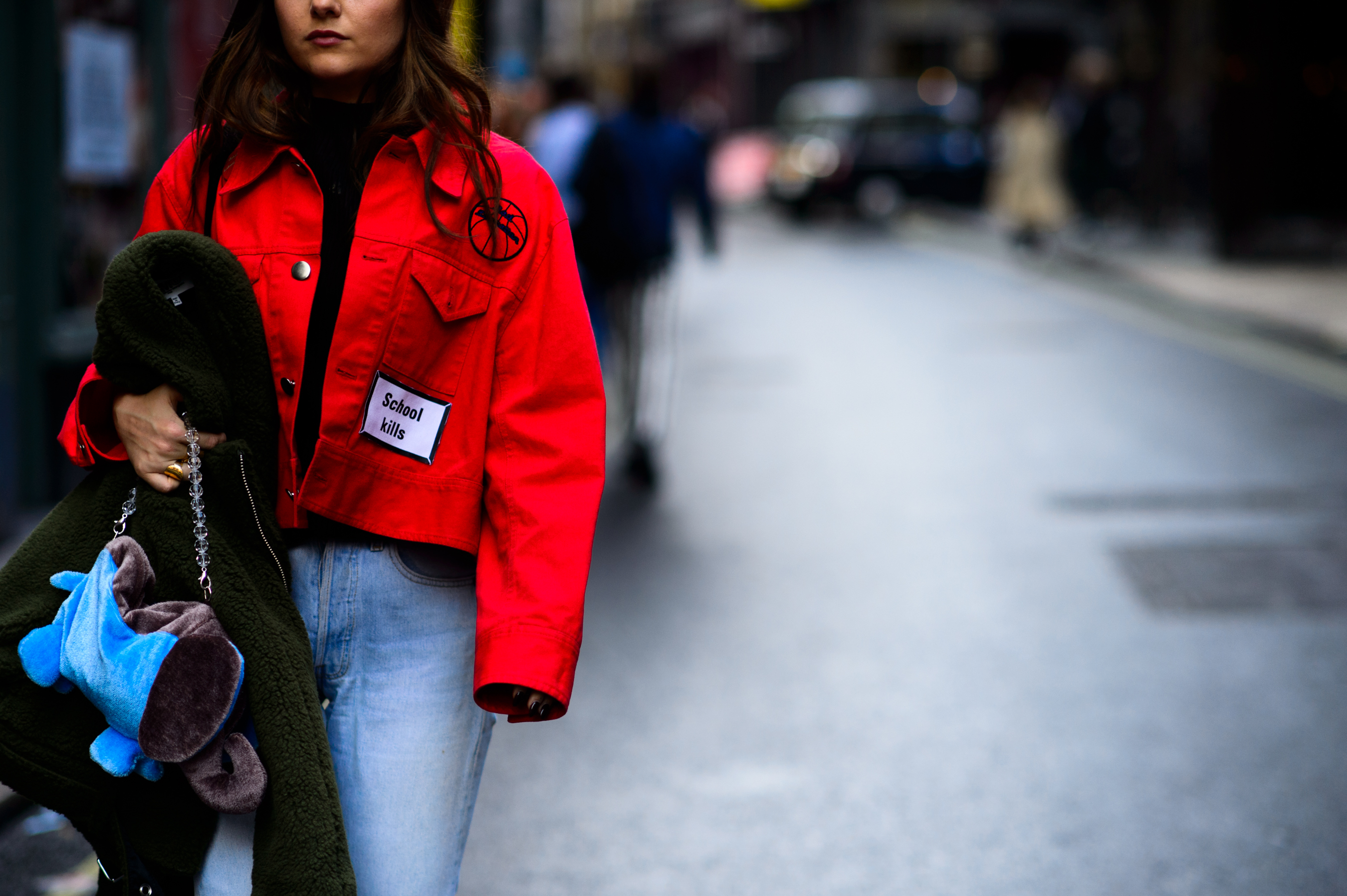 Girl wearing red jacket with patches